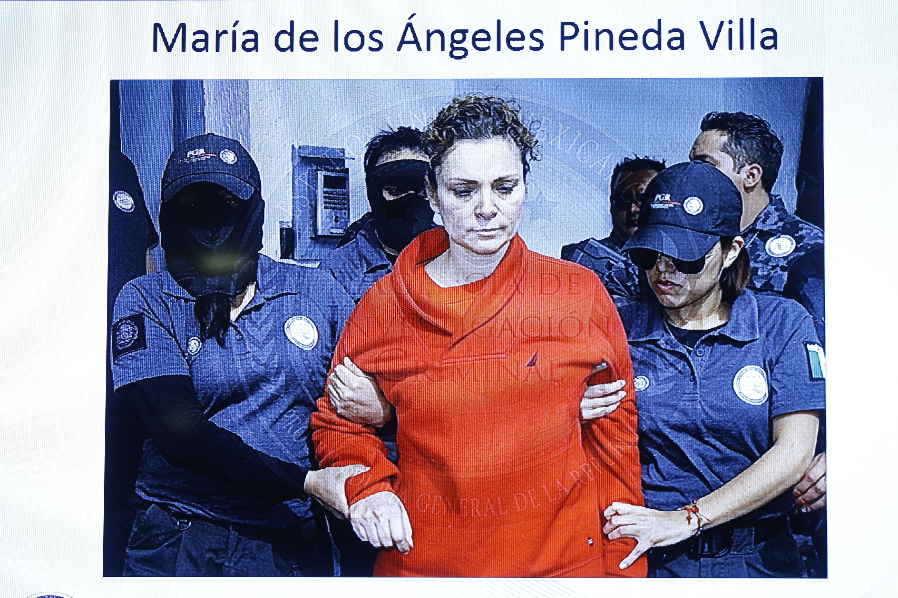 Handout of Maria de los Angeles Pineda Villa, the wife of former mayor of Iguala, Jose Luis Abarca, as seen displayed on a television screen during a news conference, while she is transferred to a prison in Nayarit town, in Mexico City