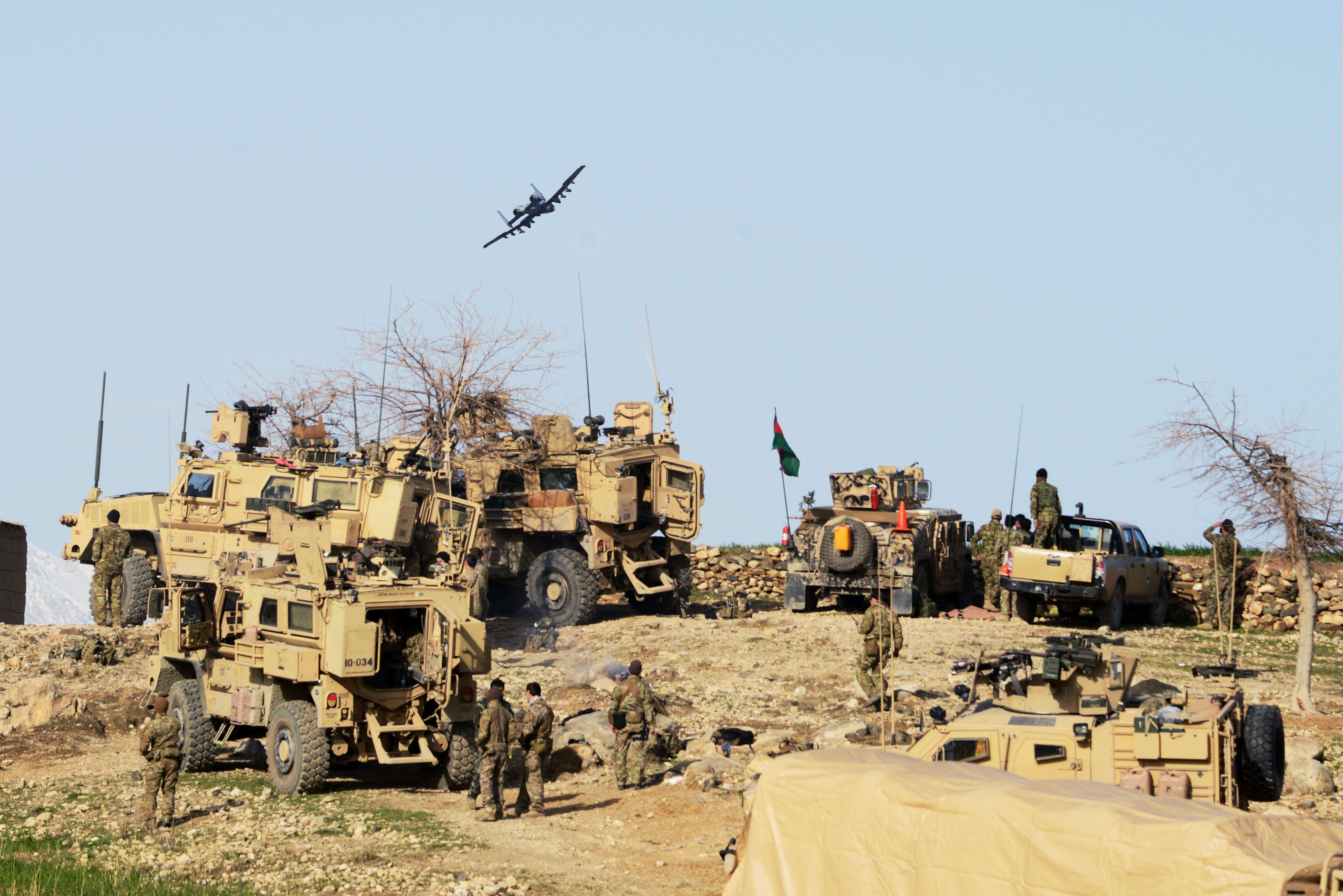 A U.S. Air Force A-10 Thunderbolt II ground attack aircraft plane flies low over US Special Forces units and Afghan soldier positions of the 4th Brigade, 201 Army Corps of the Afghan National Army (ANA) during an operation in Khogyani District on March 1