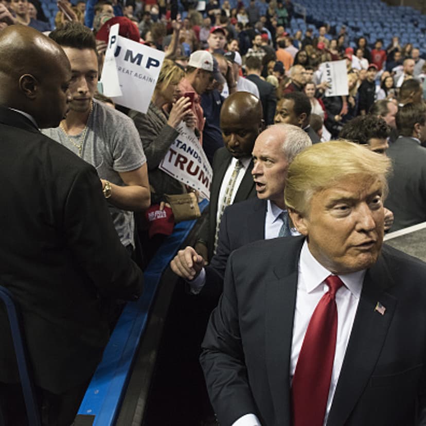 Donald Trump, president and chief executive of Trump Organization Inc. and 2016 Republican presidential candidate, right, is seen after greeting attendees during a campaign rally in Buffalo, New York, U.S., on Monday, April 18, 2016.