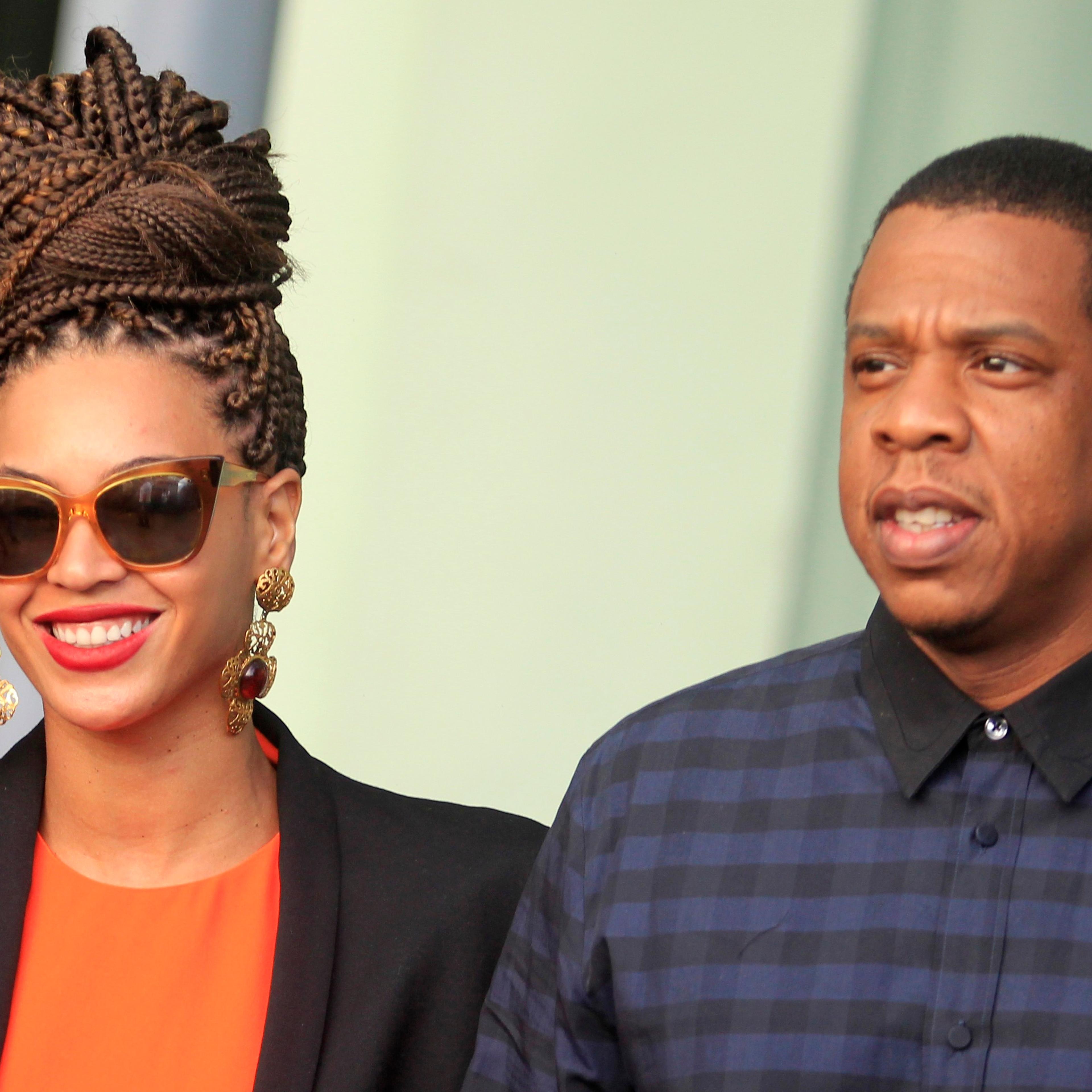 U.S. singer Beyonce and her husband rapper Jay-Z walk as they leave their hotel in Havana on April 4, 2013.
