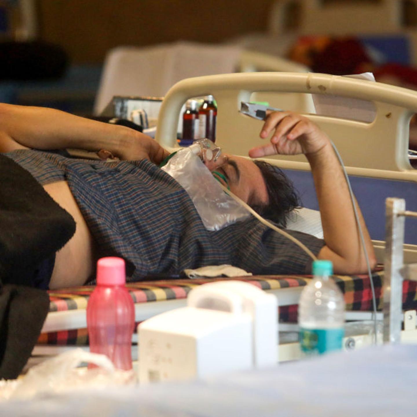 A Covid-19 patient wearing an oxygen mask inside a Covid-19