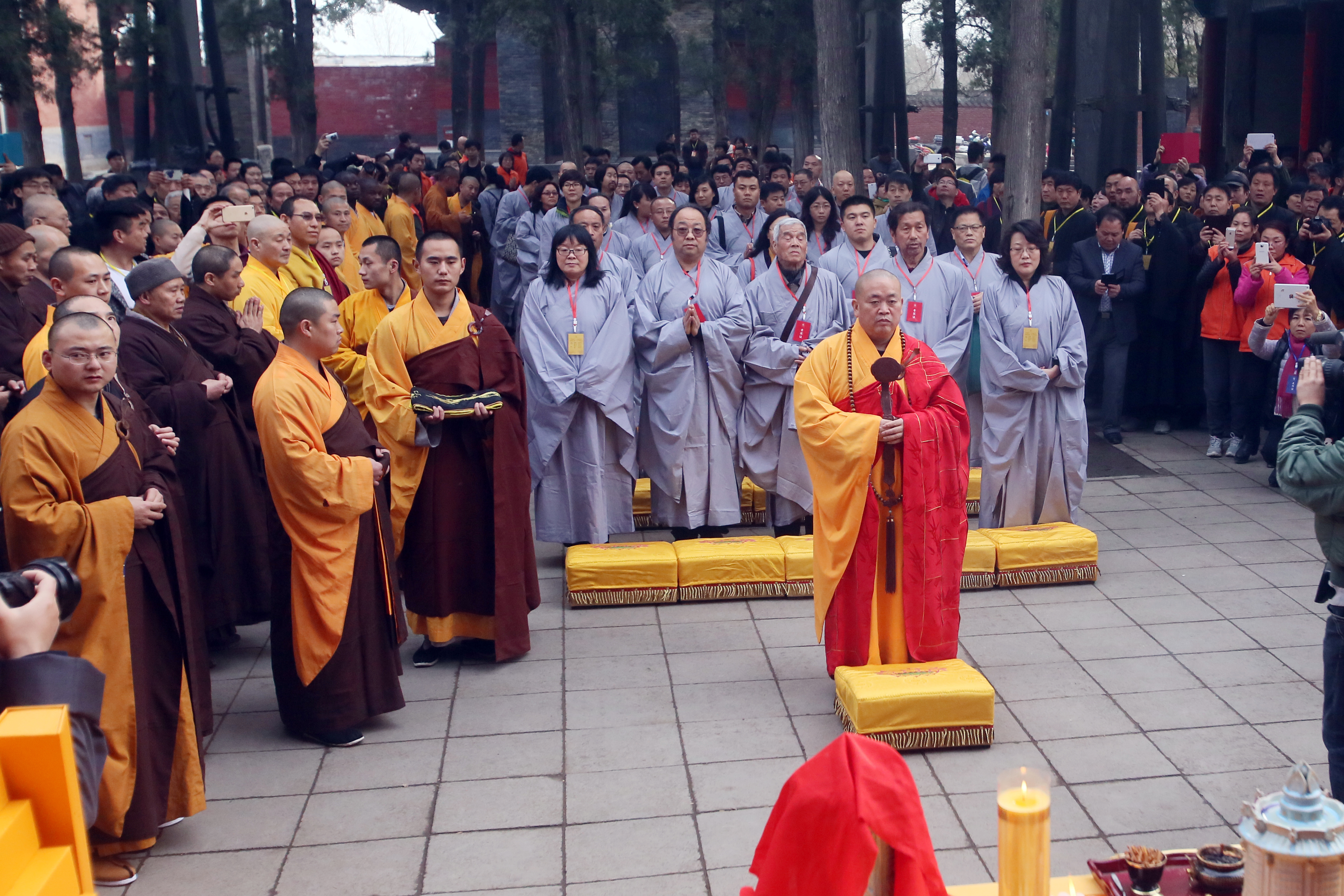 Shi Yongxin of Shaolin Temple presides over the "Ten Thousand People Copy Confucian Classics" launching ceremony on Dragon Heads-raising Day on March 21, 2015 in Zhengzhou, Henan province of China.