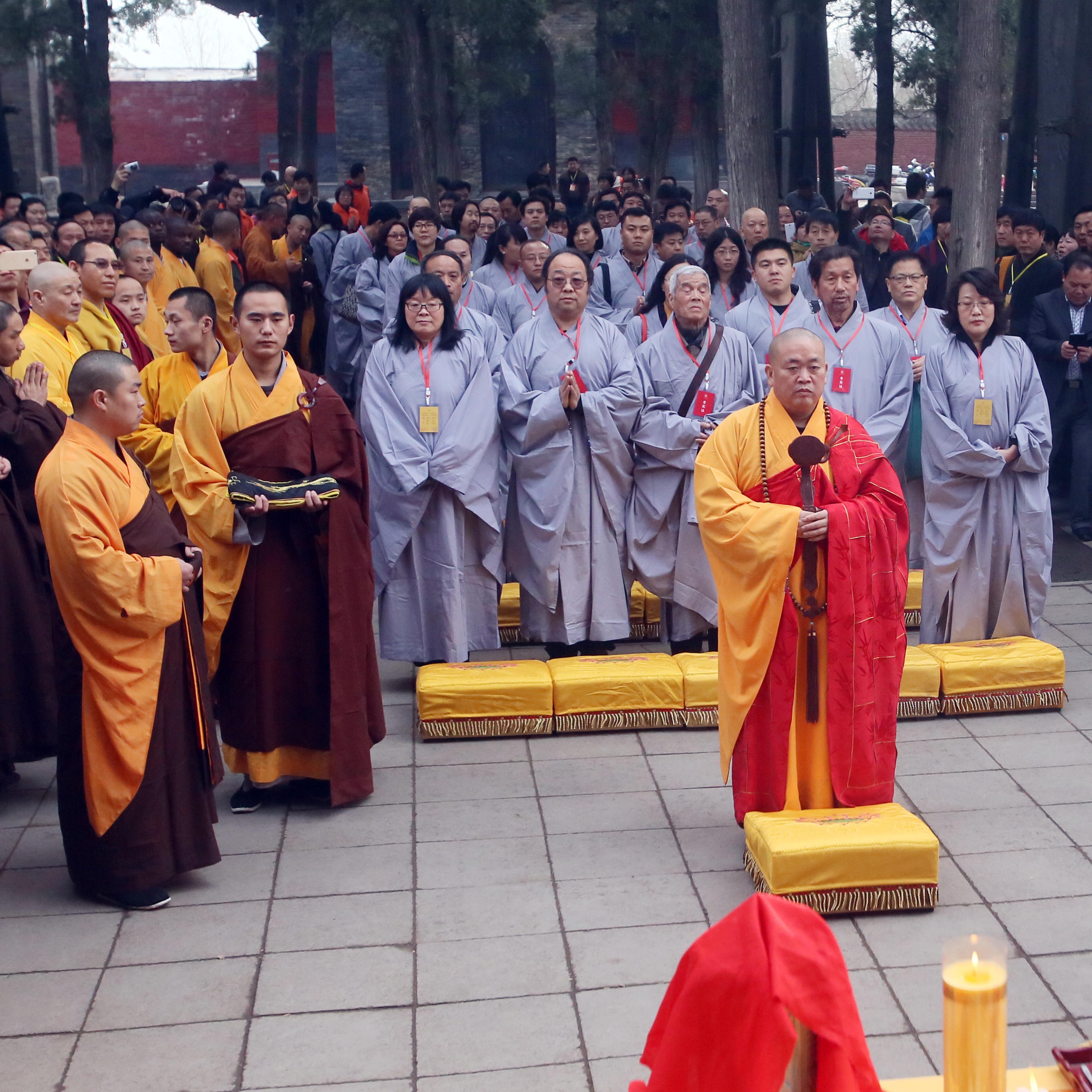 Shi Yongxin of Shaolin Temple presides over the "Ten Thousand People Copy Confucian Classics" launching ceremony on Dragon Heads-raising Day on March 21, 2015 in Zhengzhou, Henan province of China.