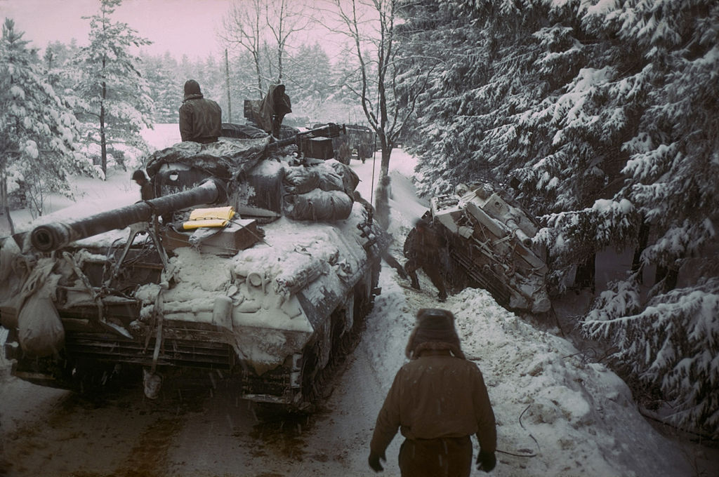 American Sherman M4 tank moves past anot