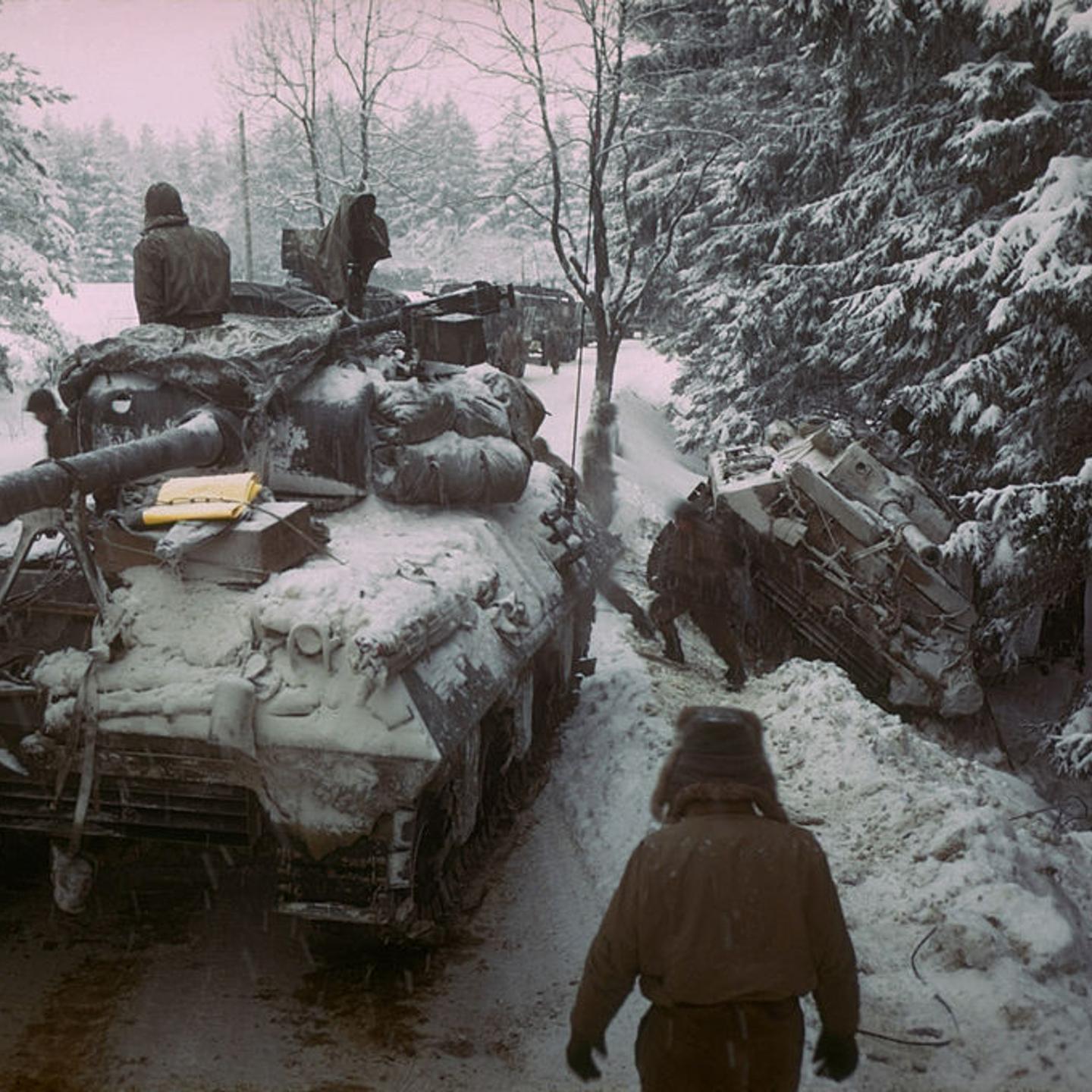 American Sherman M4 tank moves past anot