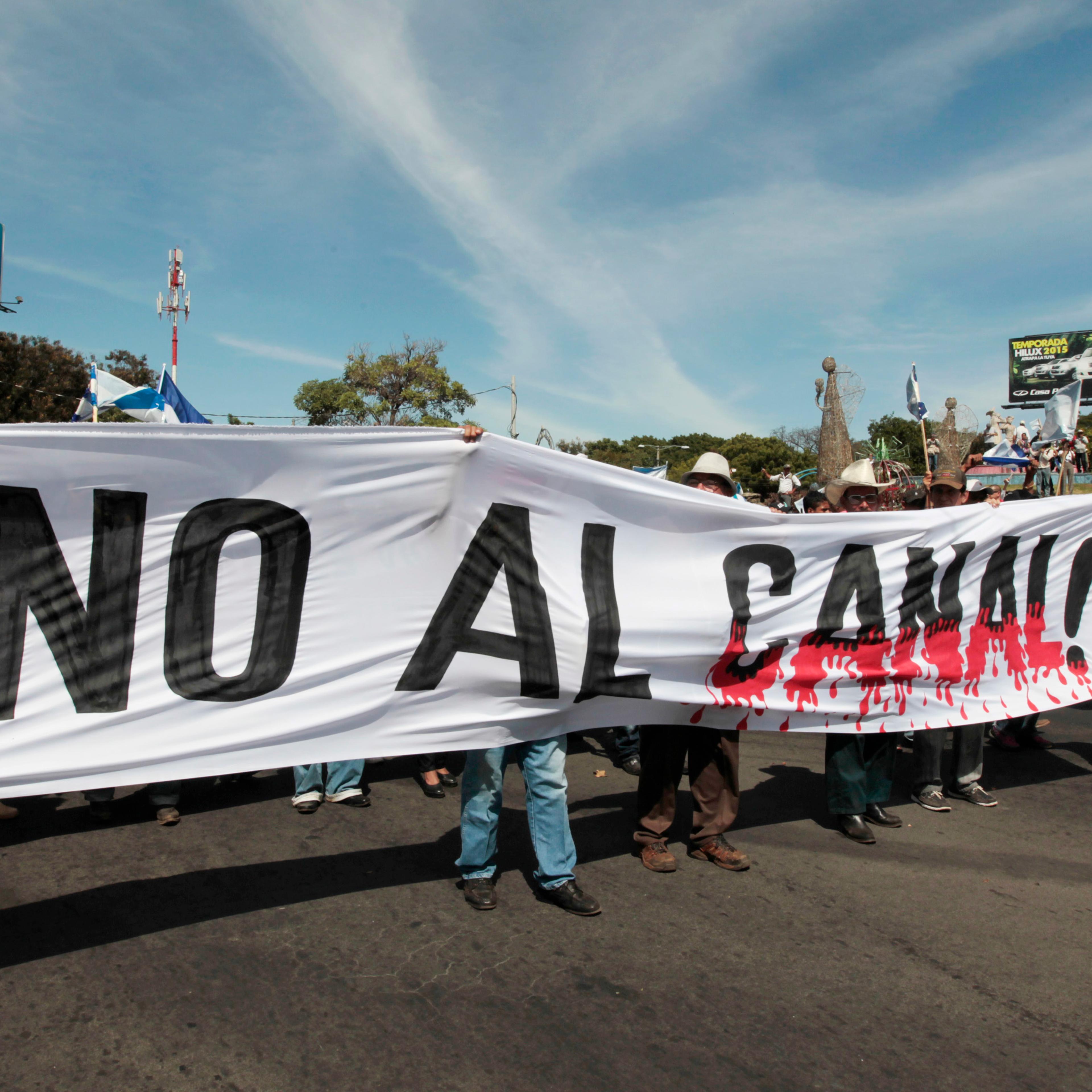 Demonstrators hold a banner during a march to protest against the construction of the Interoceanic Grand Canal in Managua
