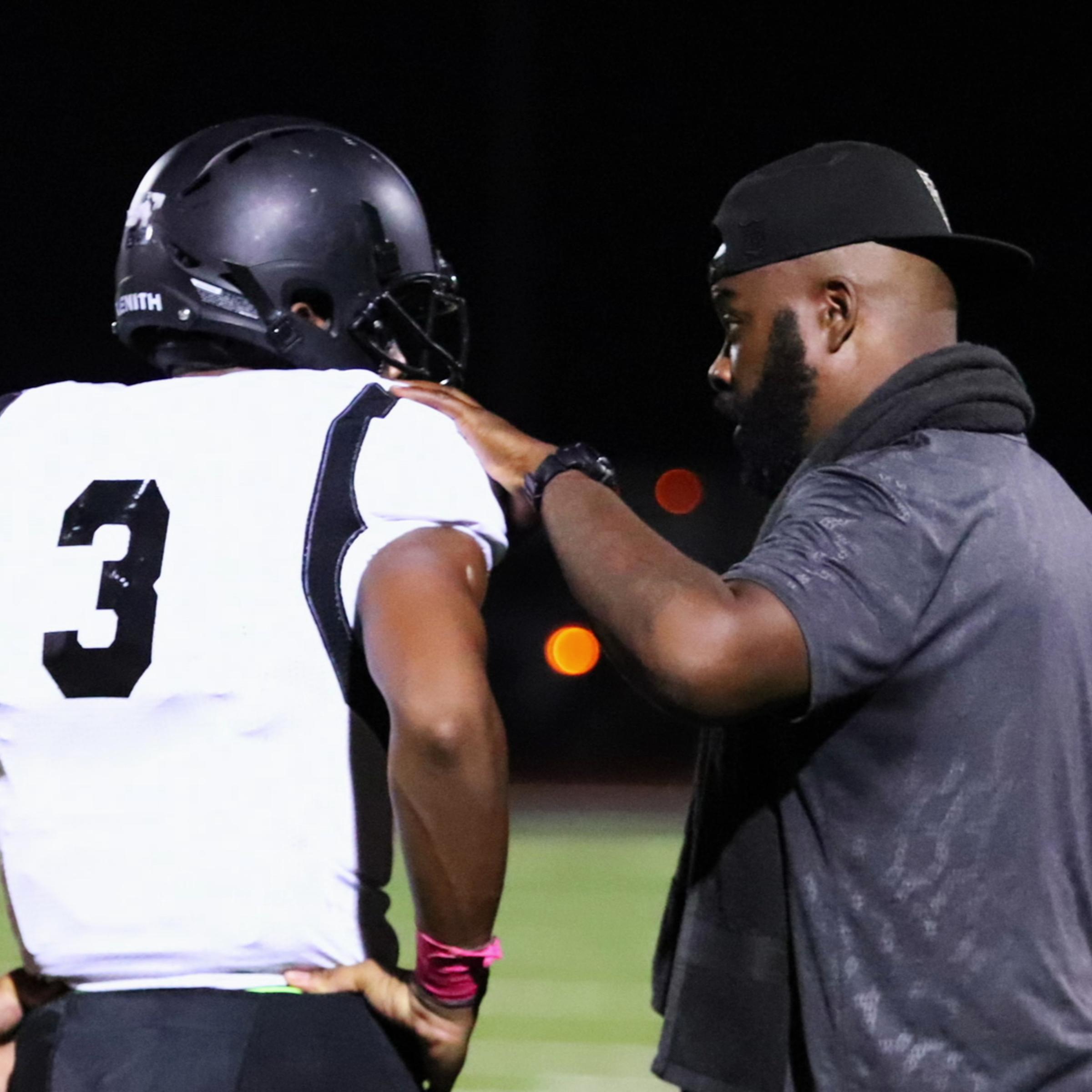 Roy Johnson with a Bishop Sycamore player