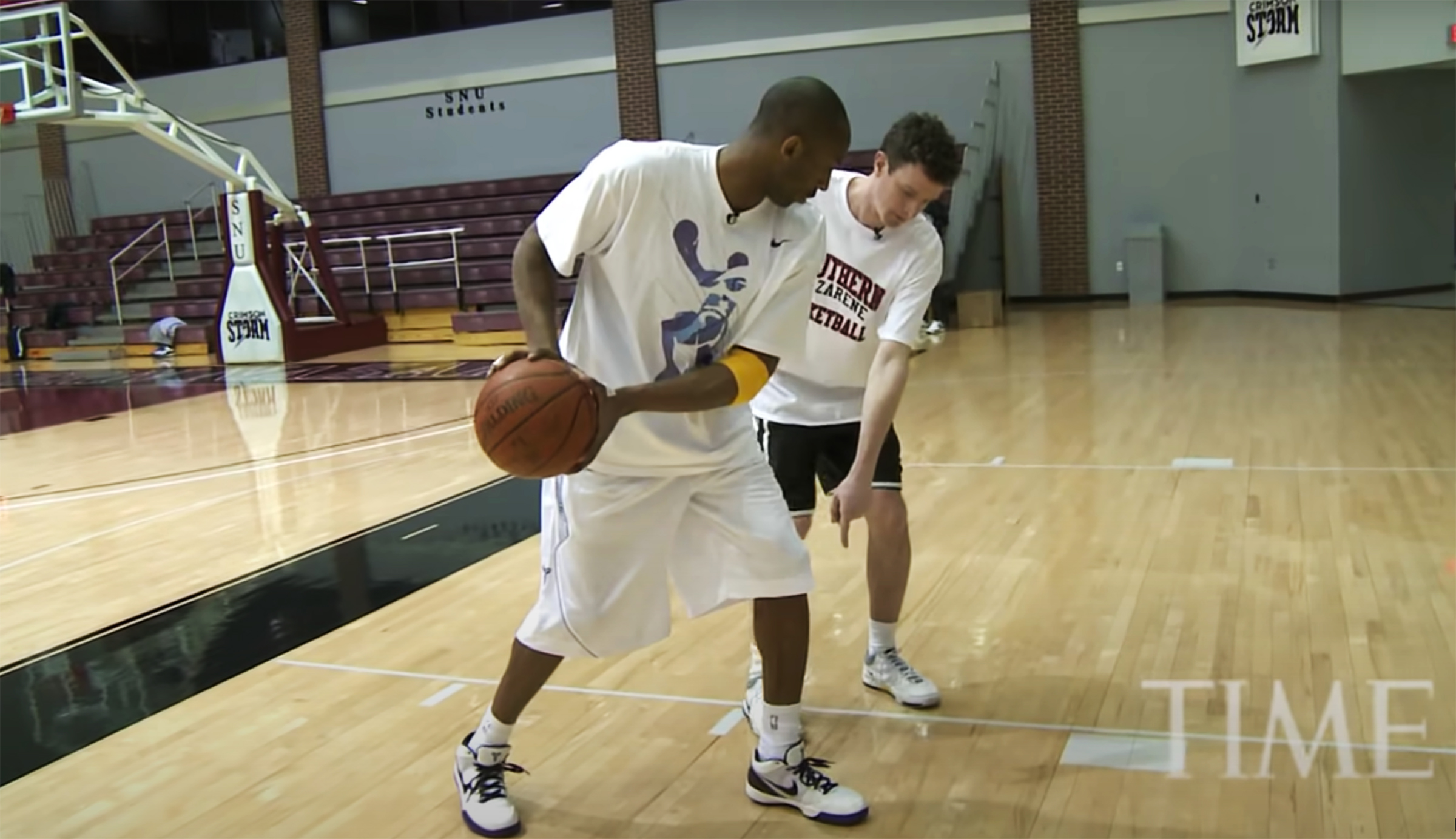 Kobe Bryant demonstrates footwork to TIME senior correspondent Sean Gregory at Southern Nazarene University in Oklahoma City on February 23, 2009. 