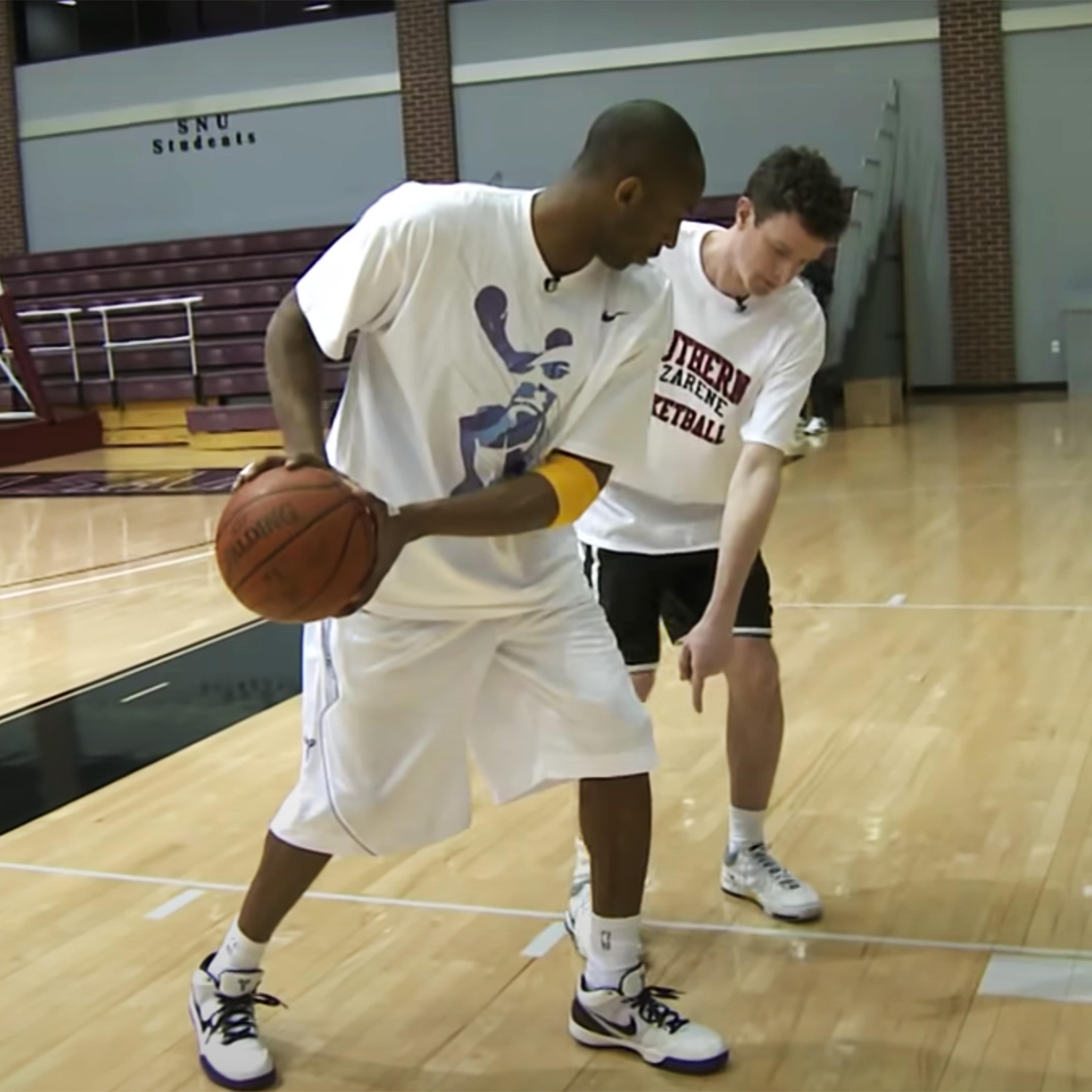 Kobe Bryant demonstrates footwork to TIME senior correspondent Sean Gregory at Southern Nazarene University in Oklahoma City on February 23, 2009.
