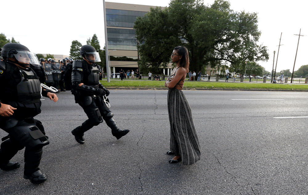 Protestor Ieshia Evans is detained by law enforcement near the headquarters of the Baton Rouge Police Department in Baton Rouge, Louisiana, July 9, 2016.