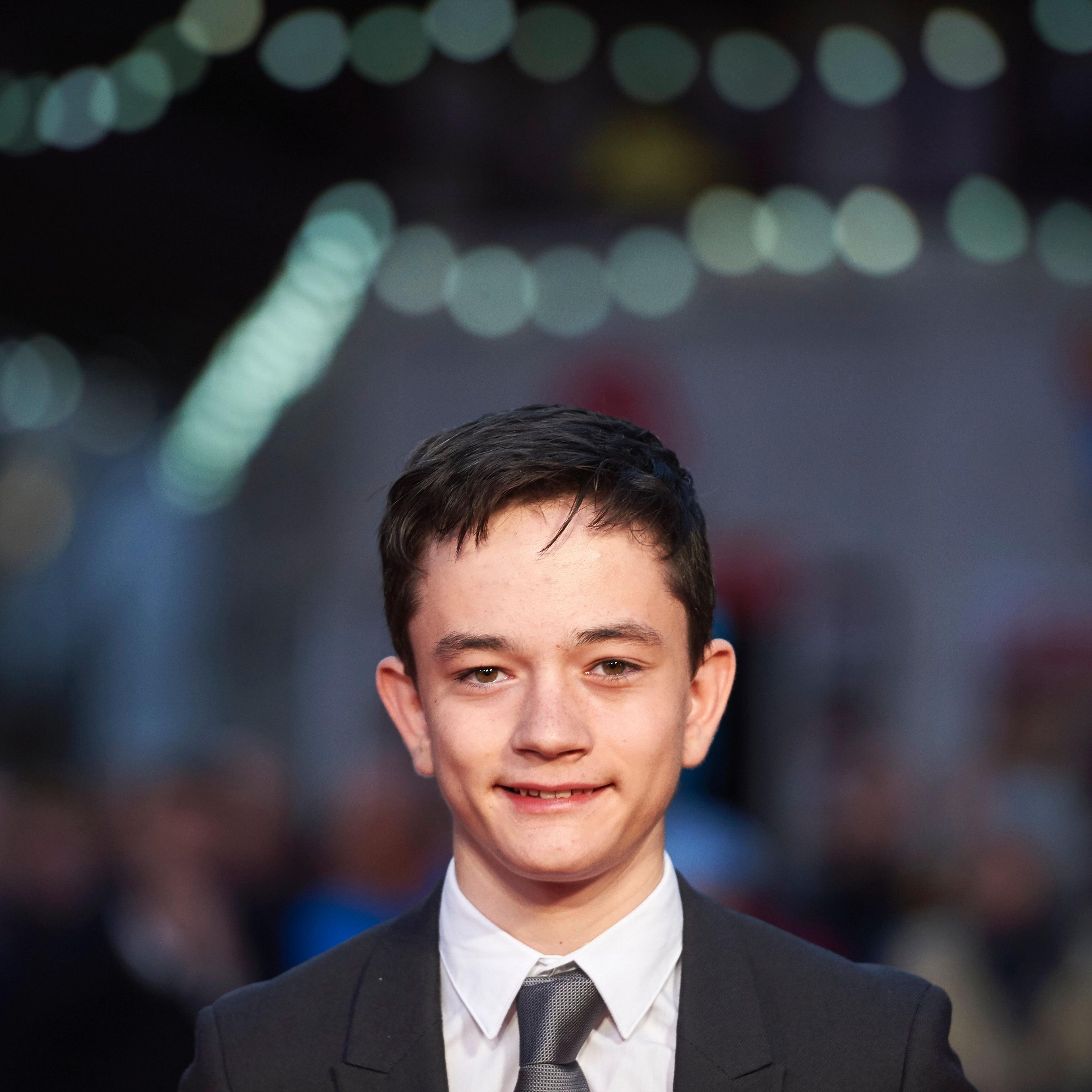 British actor Lewis MacDougall poses on the red carpet as he arrives to attend a gala screening of the film "A Monster Calls" during the BFI London Film Festival in London on October 6, 2016.