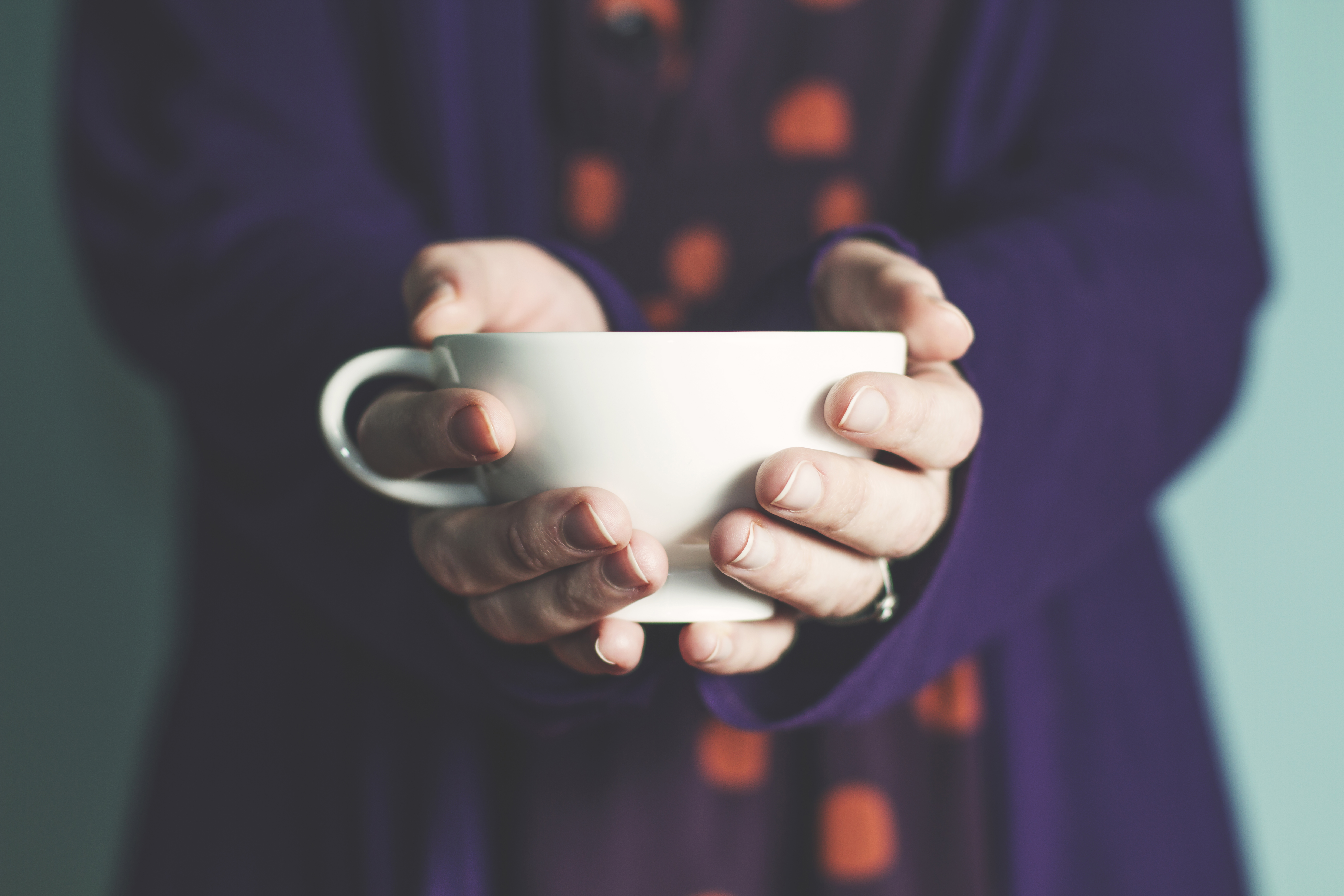 woman-giving-cup