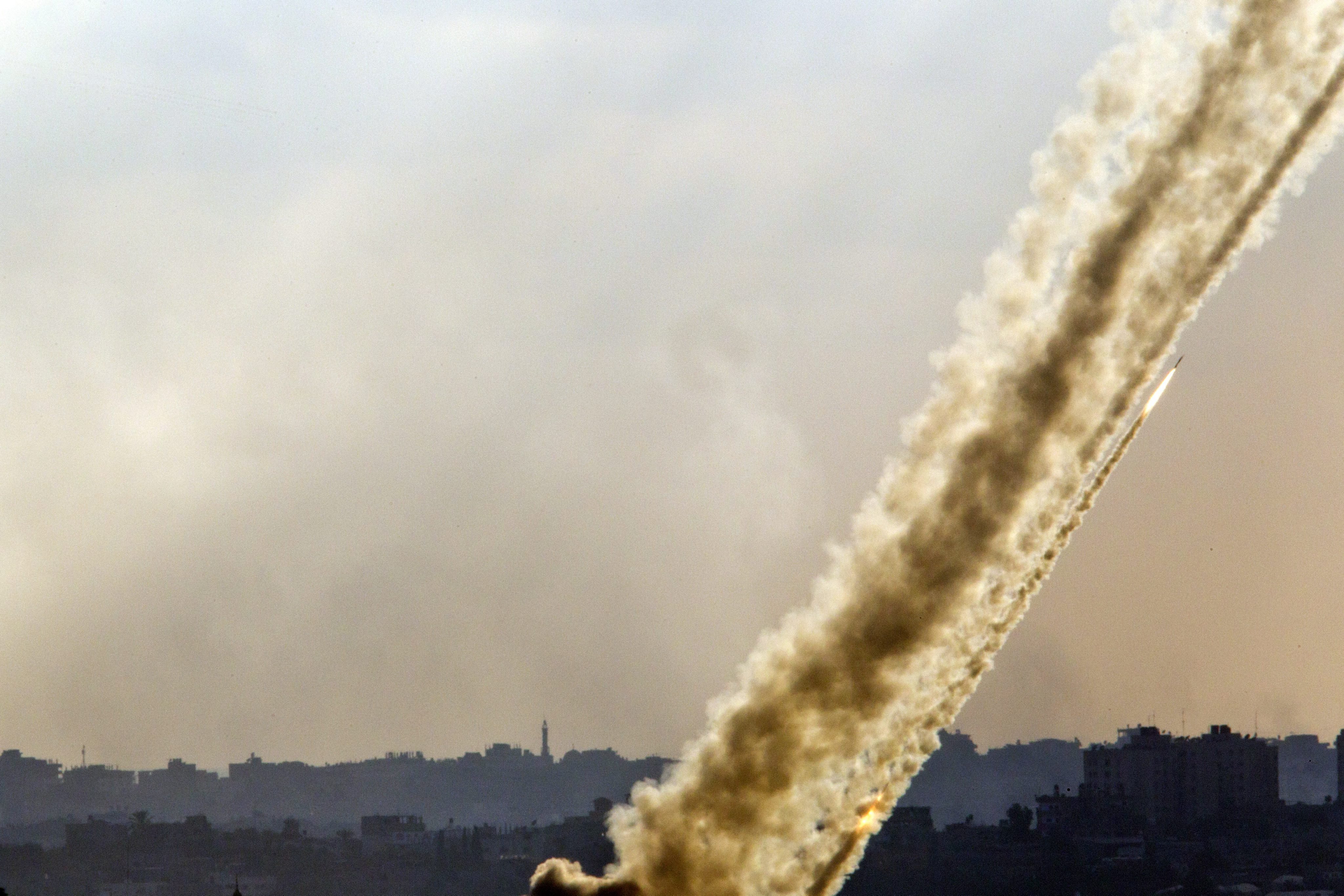 Multiple rocket launches from a site inside the Gaza Strip firing towards Israel as seen from a lookout point in southern Israel on July 17, 2014.