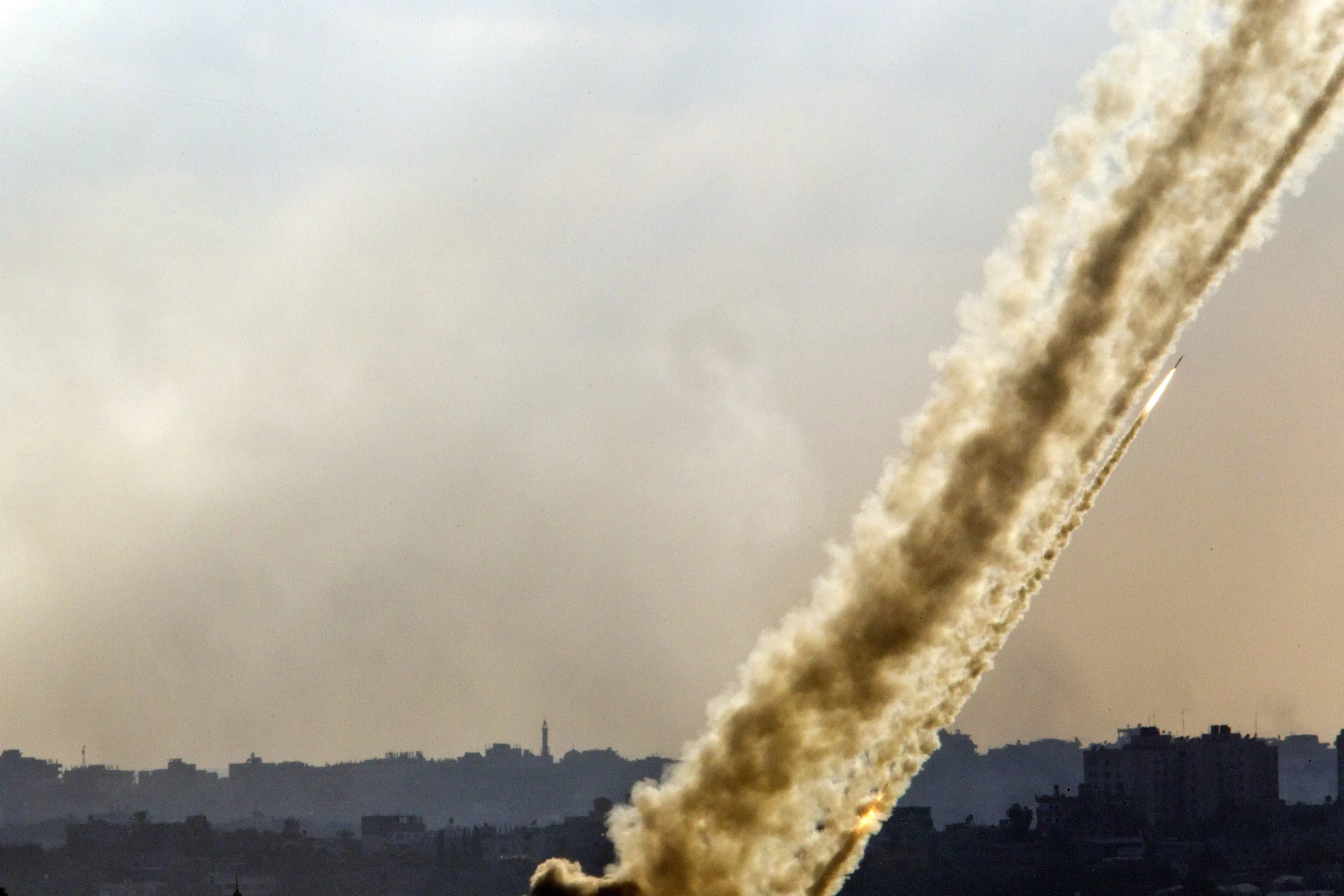Multiple rocket launches from a site inside the Gaza Strip firing towards Israel as seen from a lookout point in southern Israel on July 17, 2014.