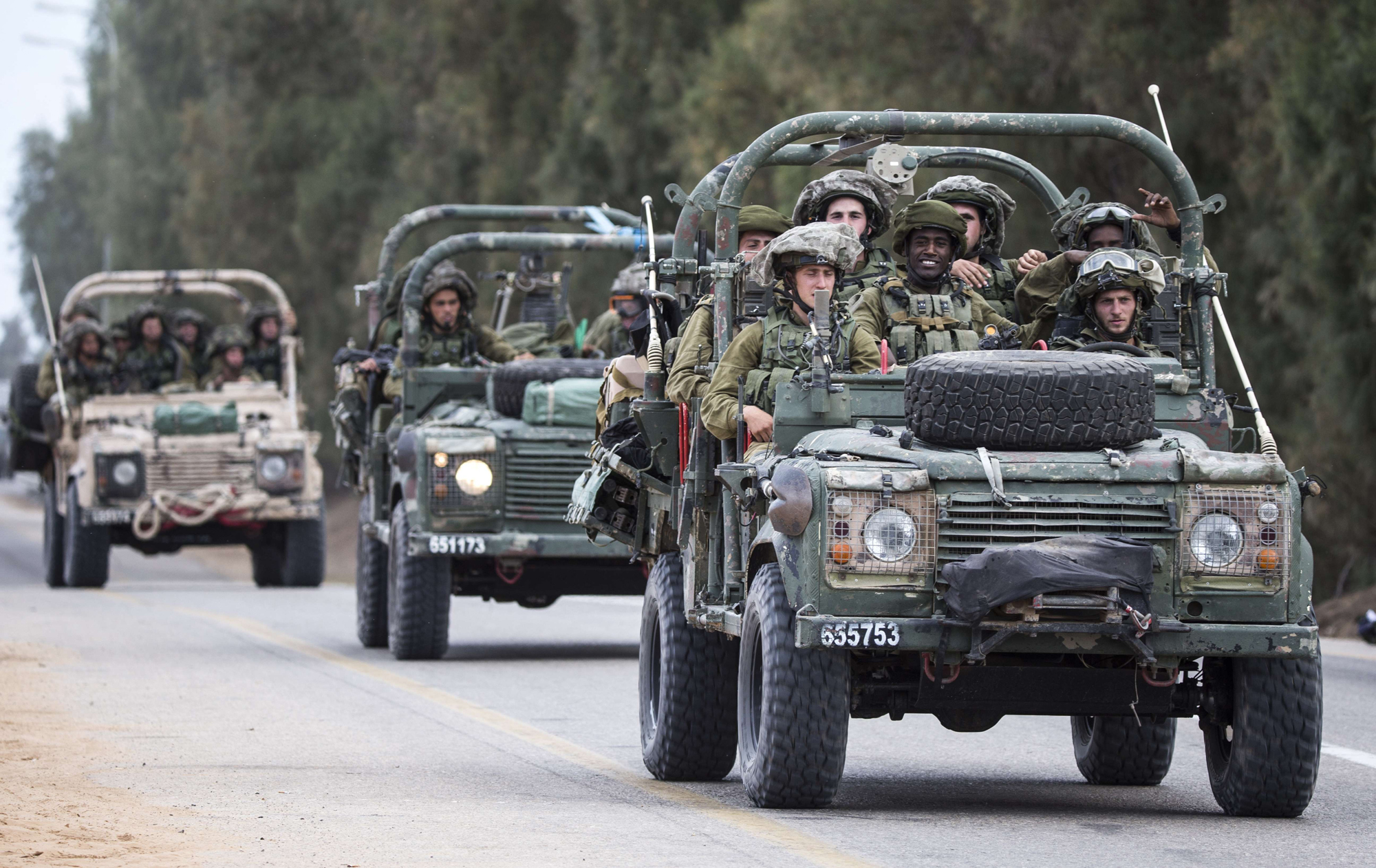 Israeli soldiers patrol along the southern Israeli border with the Gaza Strip following Israeli air strikes in the Palestinian coastal enclave before a five-hour truce went into effect, on July 17, 2014.