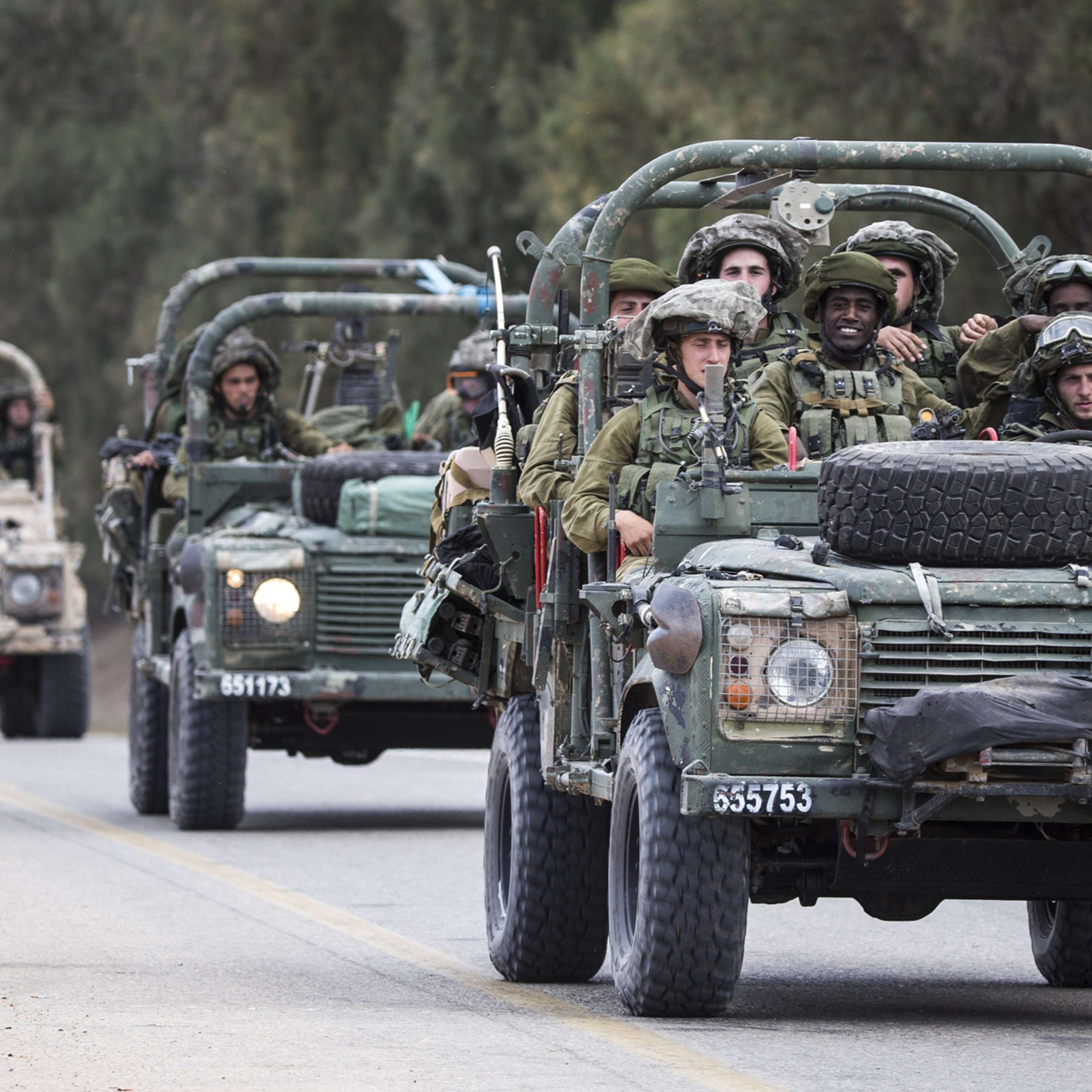 Israeli soldiers patrol along the southern Israeli border with the Gaza Strip following Israeli air strikes in the Palestinian coastal enclave before a five-hour truce went into effect, on July 17, 2014.