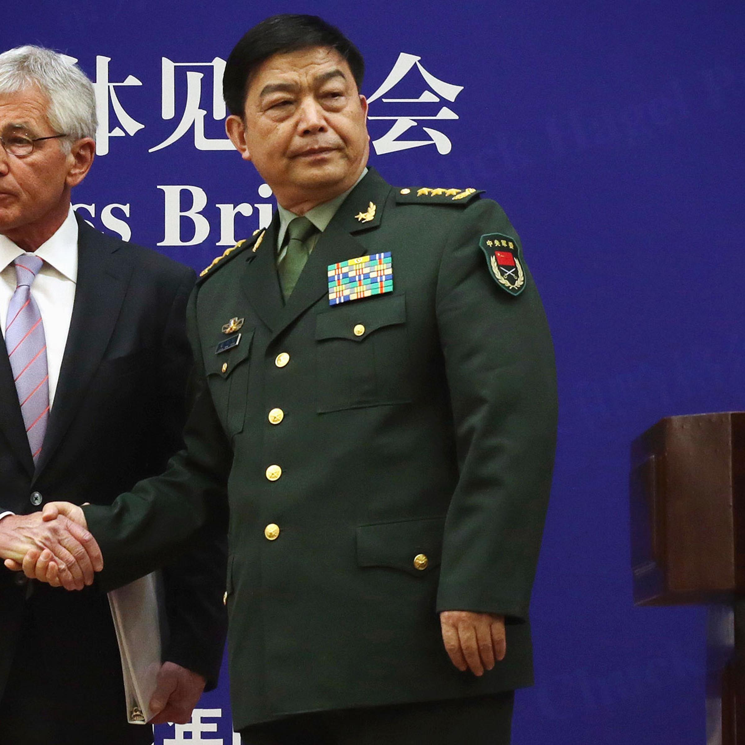 U.S. Secretary of Defense Chuck Hagel (L) and Chinese Minister of Defense Chang Wanquan (R) shake hands at the end of a joint news conference at the Chinese Defense Ministry headquarters April 8, 2014 in Beijing, China