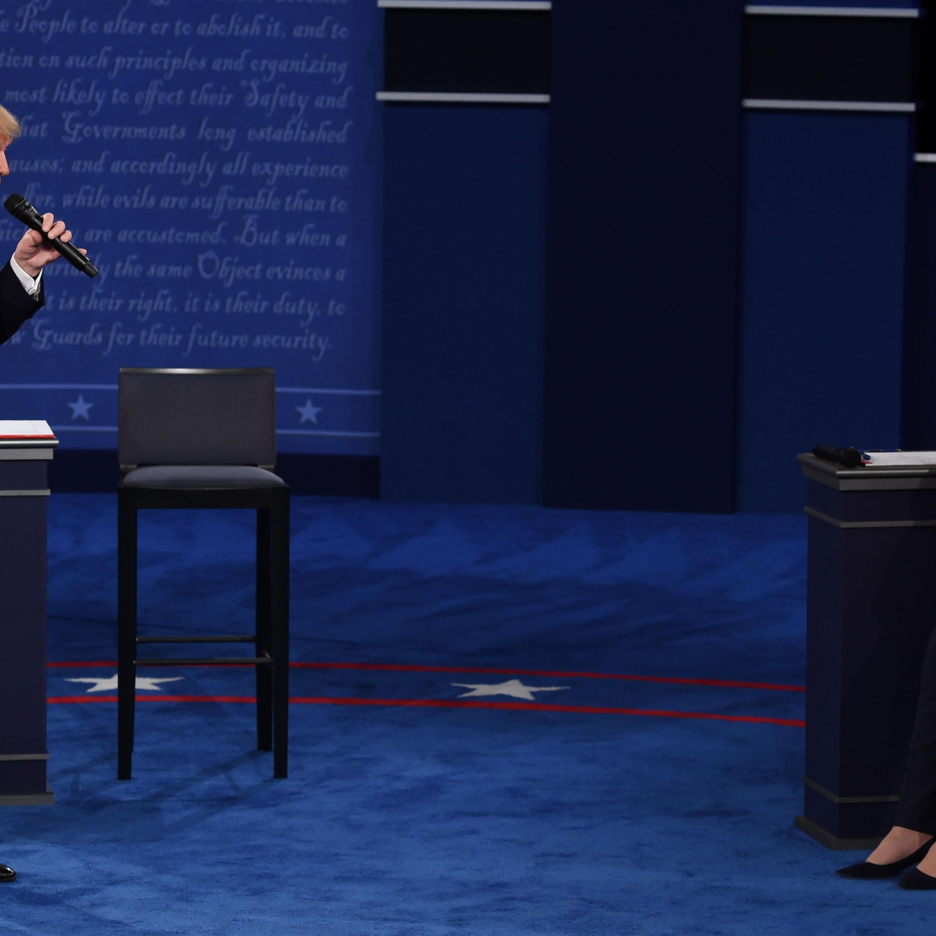 Democratic presidential candidate Hillary Clinton and Republican presidential candidate Donald Trump debate during the second presidential debate at Washington University in St. Louis on Oct. 9, 2016.