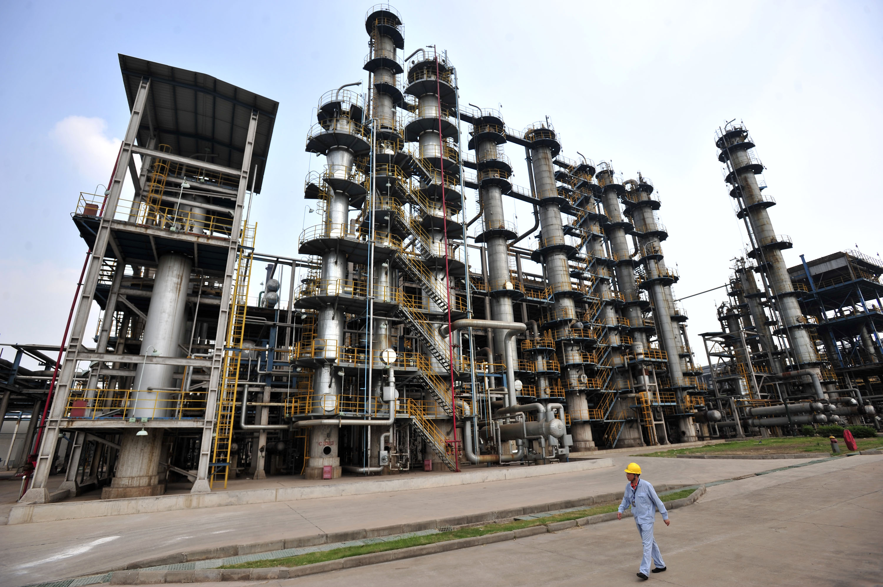This photo taken on May 10, 2011 shows a worker walking by at an oil refinery of China's Sinopec, in Wuhan, central China's Hubei province.