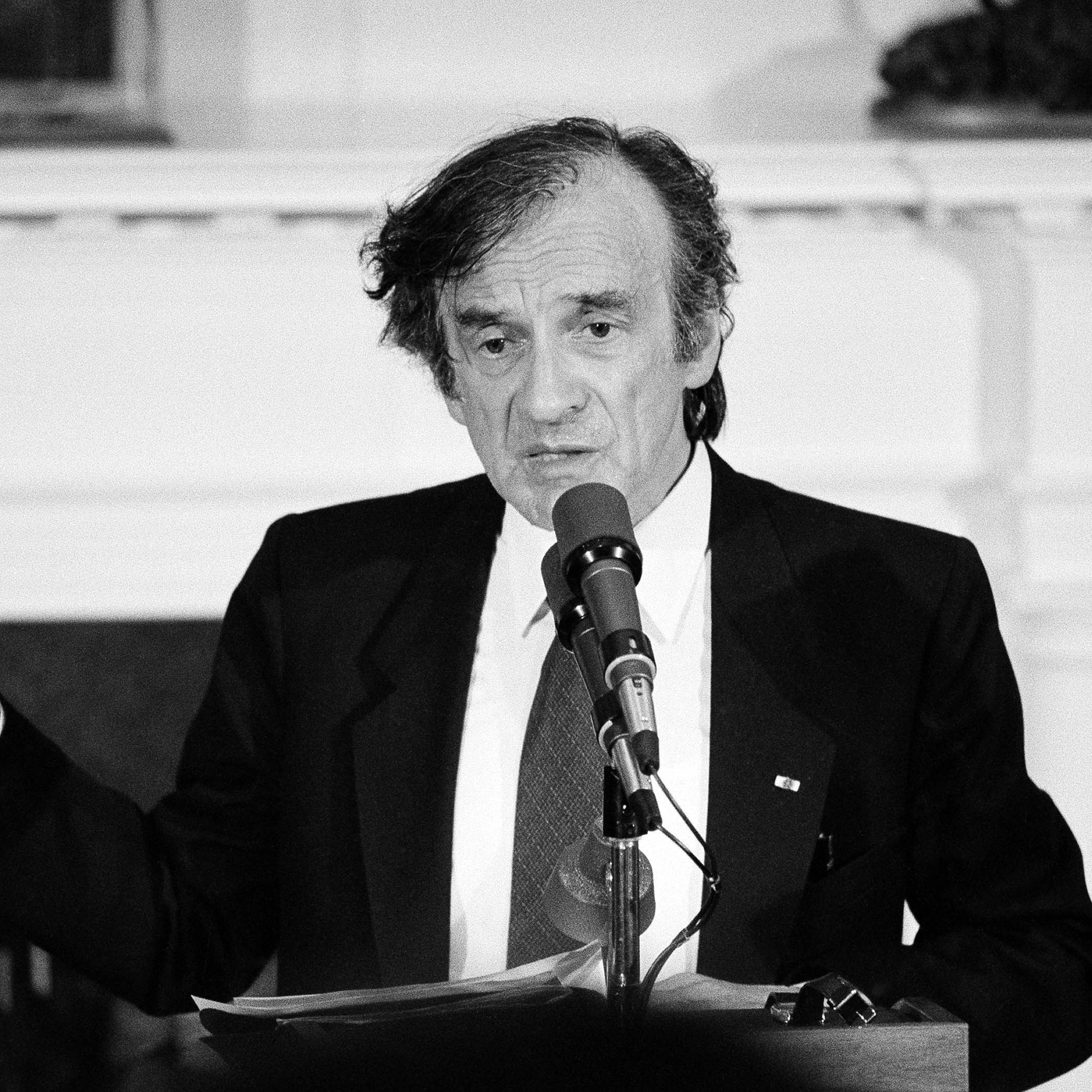 Holocaust survivor Elie Wiesel gestures while talking during a White House ceremony when President Ronald Reagan presented him with the Congressional Gold Medal on April 20, 1985.