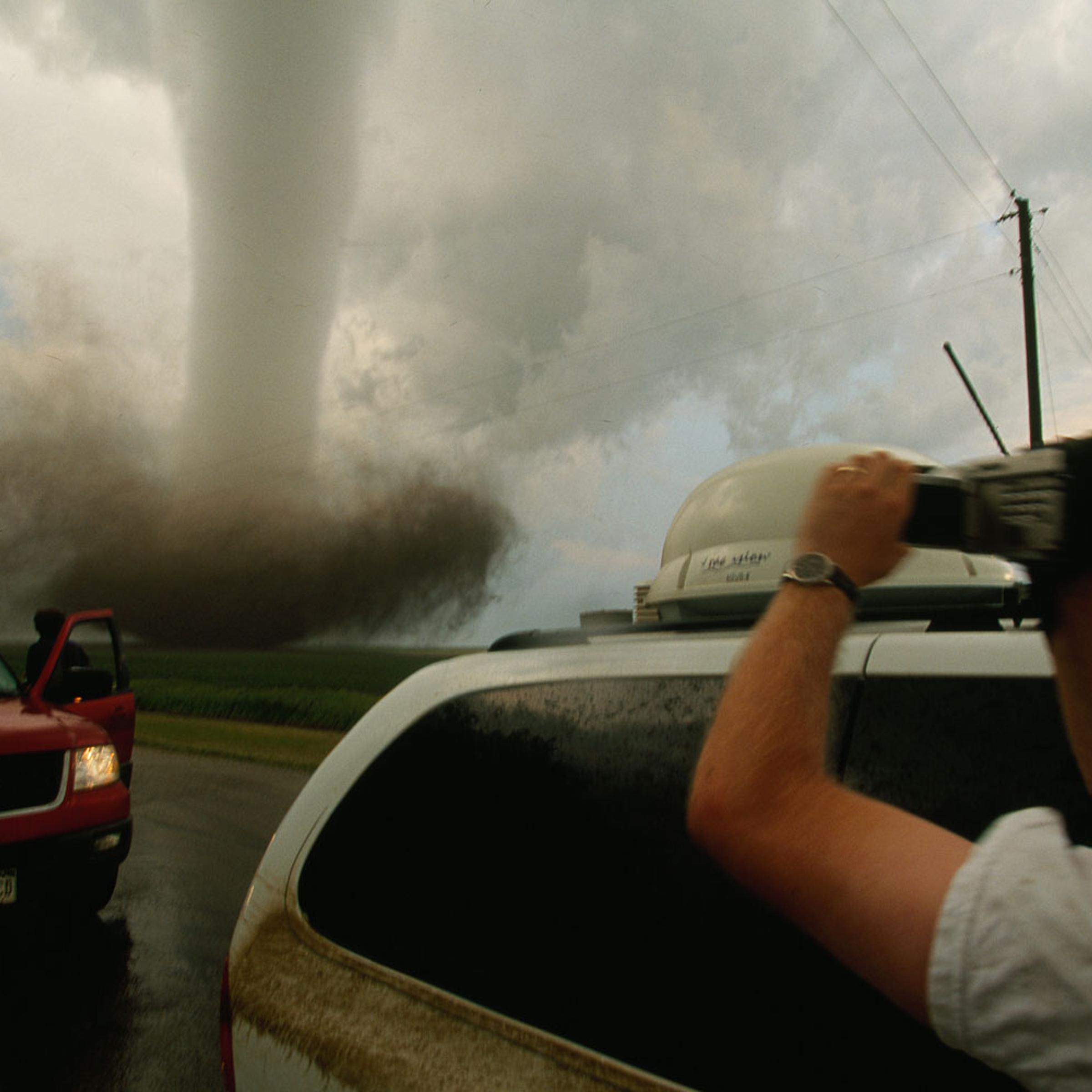 A storm chaser video taping a very close tornado