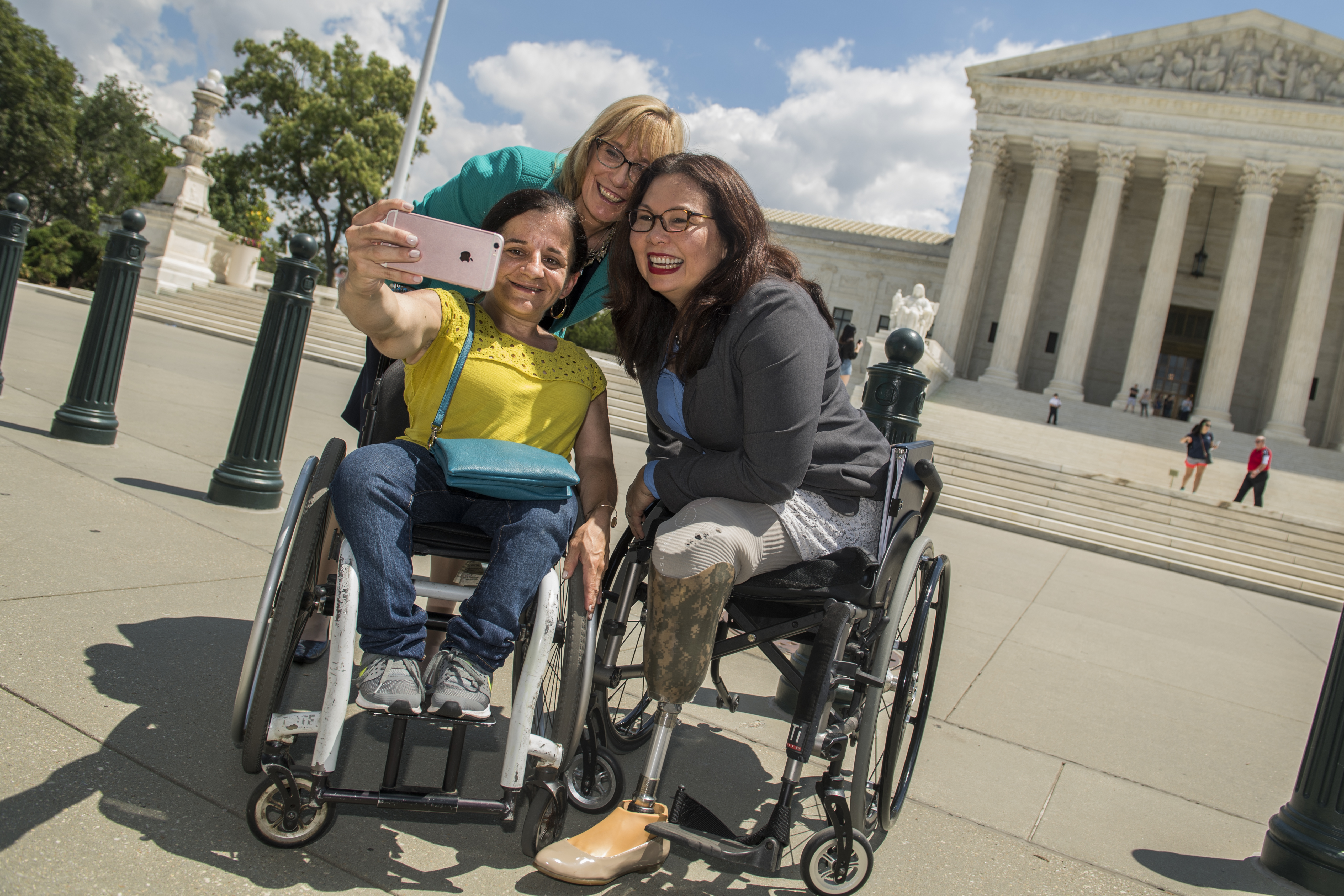 Duckworth takes a selfie with two others