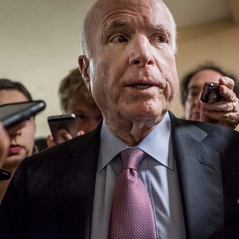 With crowds of journalists asking questions about President Donald Trump and former FBI Director James Comey, Senator John McCain (R-AZ) rushes to the Senate floor for votes on Capitol Hill Wednesday May 17, 2017.
