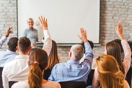 meeting-participants-raising-hands