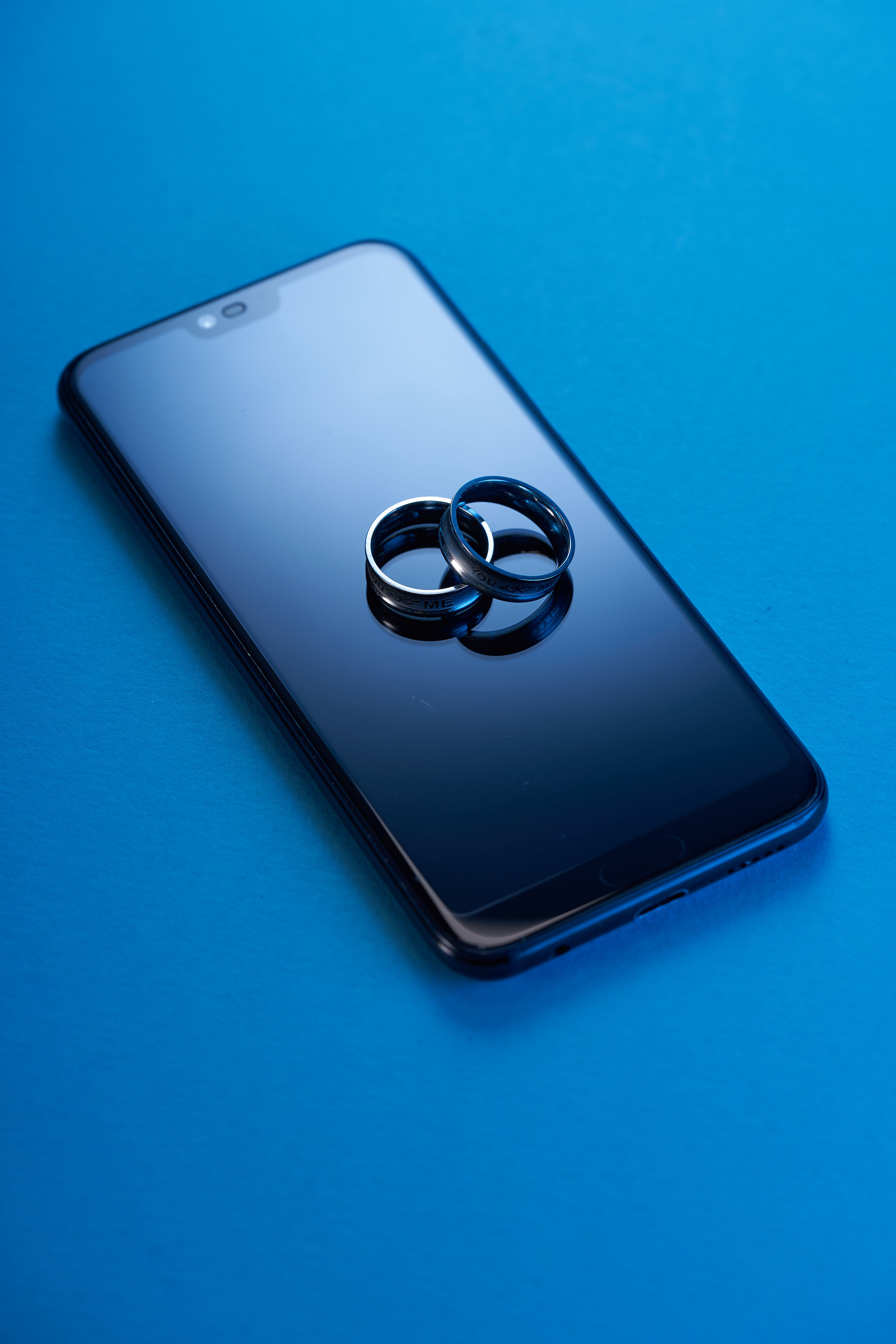 Pair of rings  on top of  smartphone display