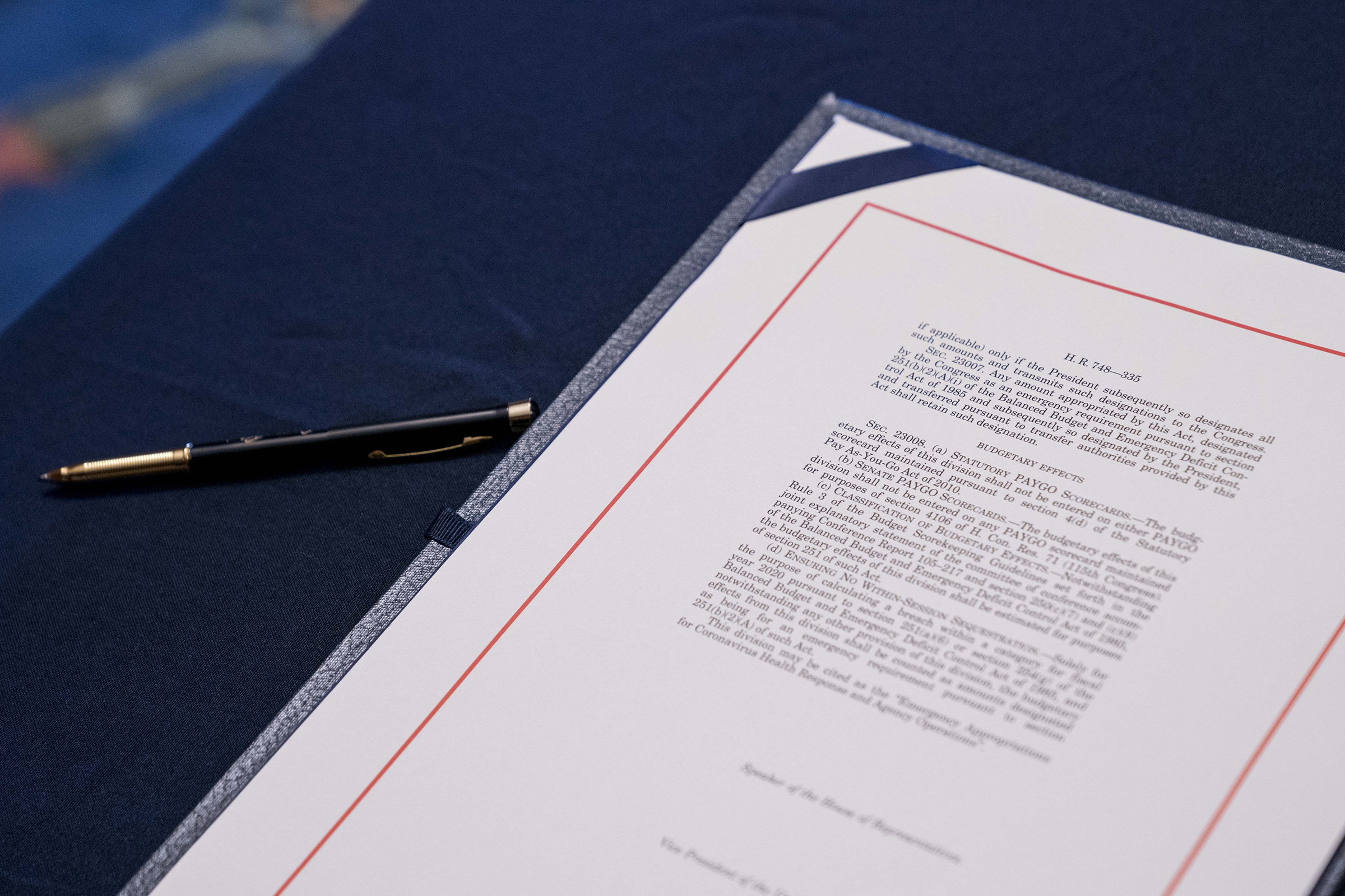 A copy of H.R. 748, Coronavirus Aid, Relief, and Economic Security (CARES) Act, sits on a table before a signing ceremony at the U.S. Capitol in Washington, D.C. on March 27.
