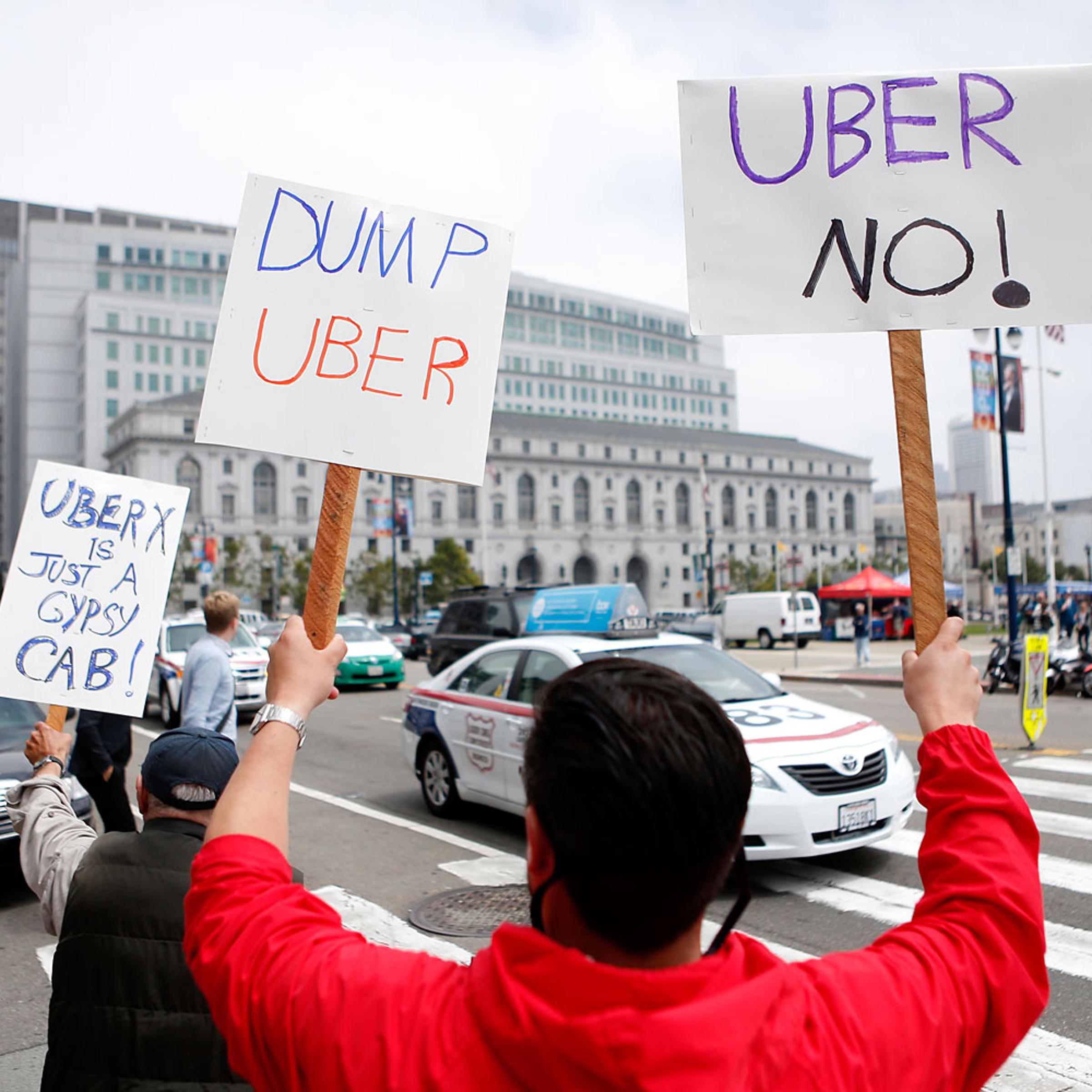 San Francisco taxi drivers show their opposition to Uber which taxi drivers say is operating illegally in San Francisco