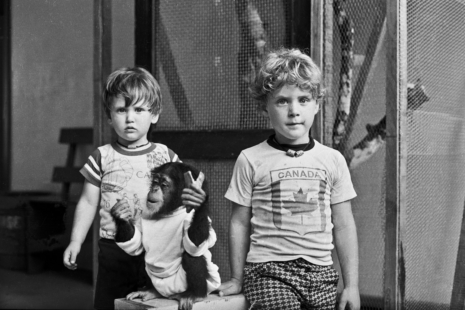 Jeff, Evelyn and Andrew in the carport. 1977.