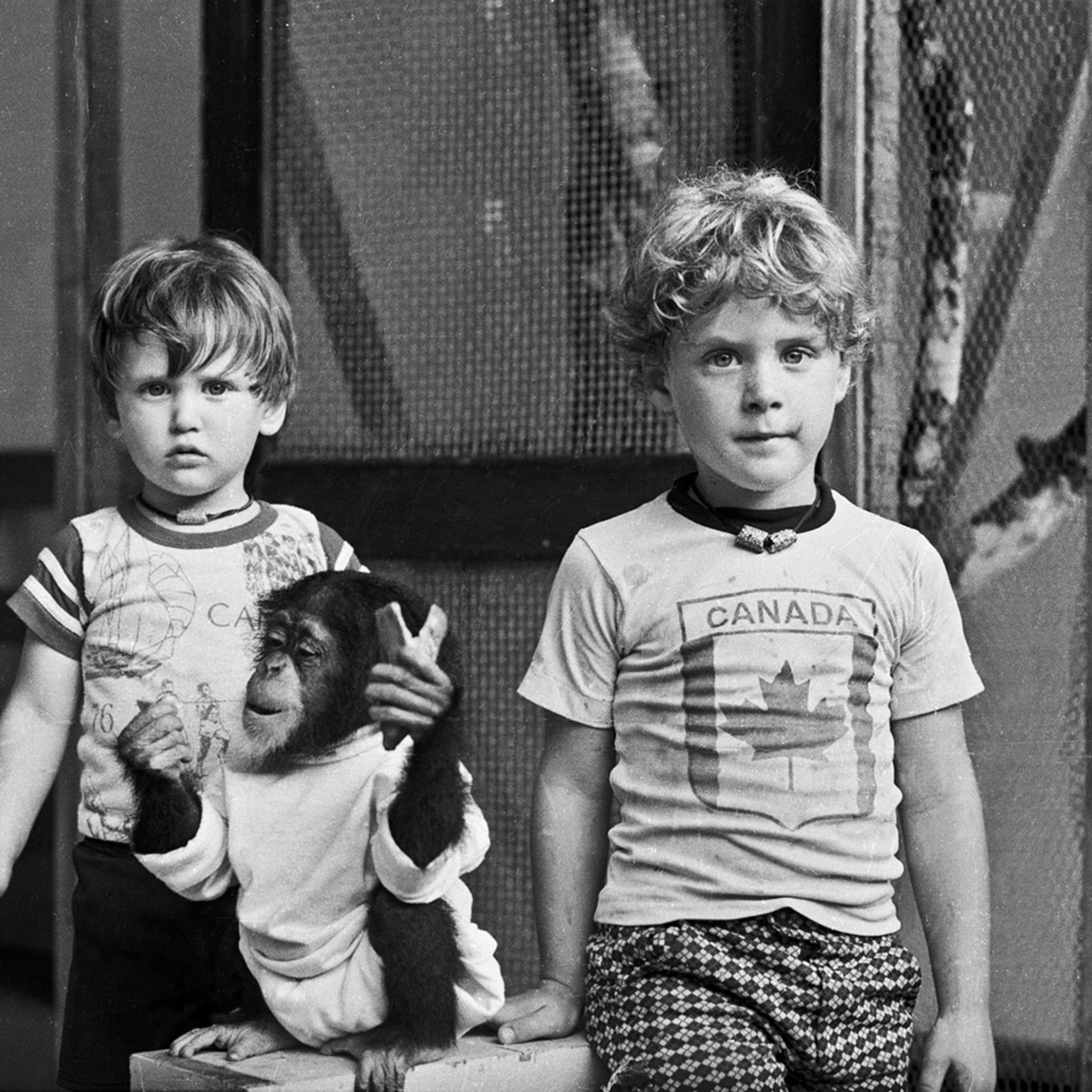 Jeff, Evelyn and Andrew in the carport. 1977.