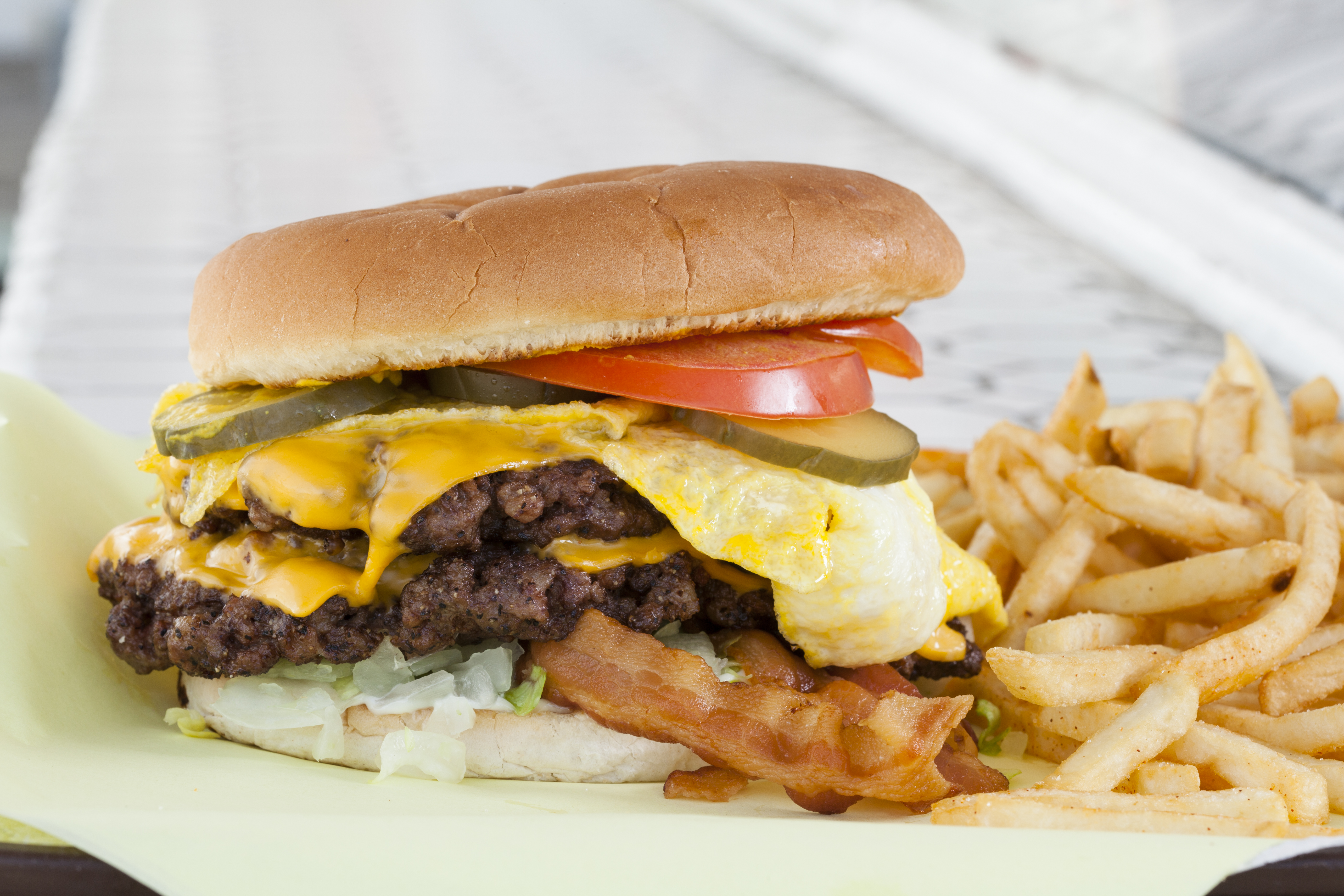 Double cheeseburger with egg, bacon &amp; french fries