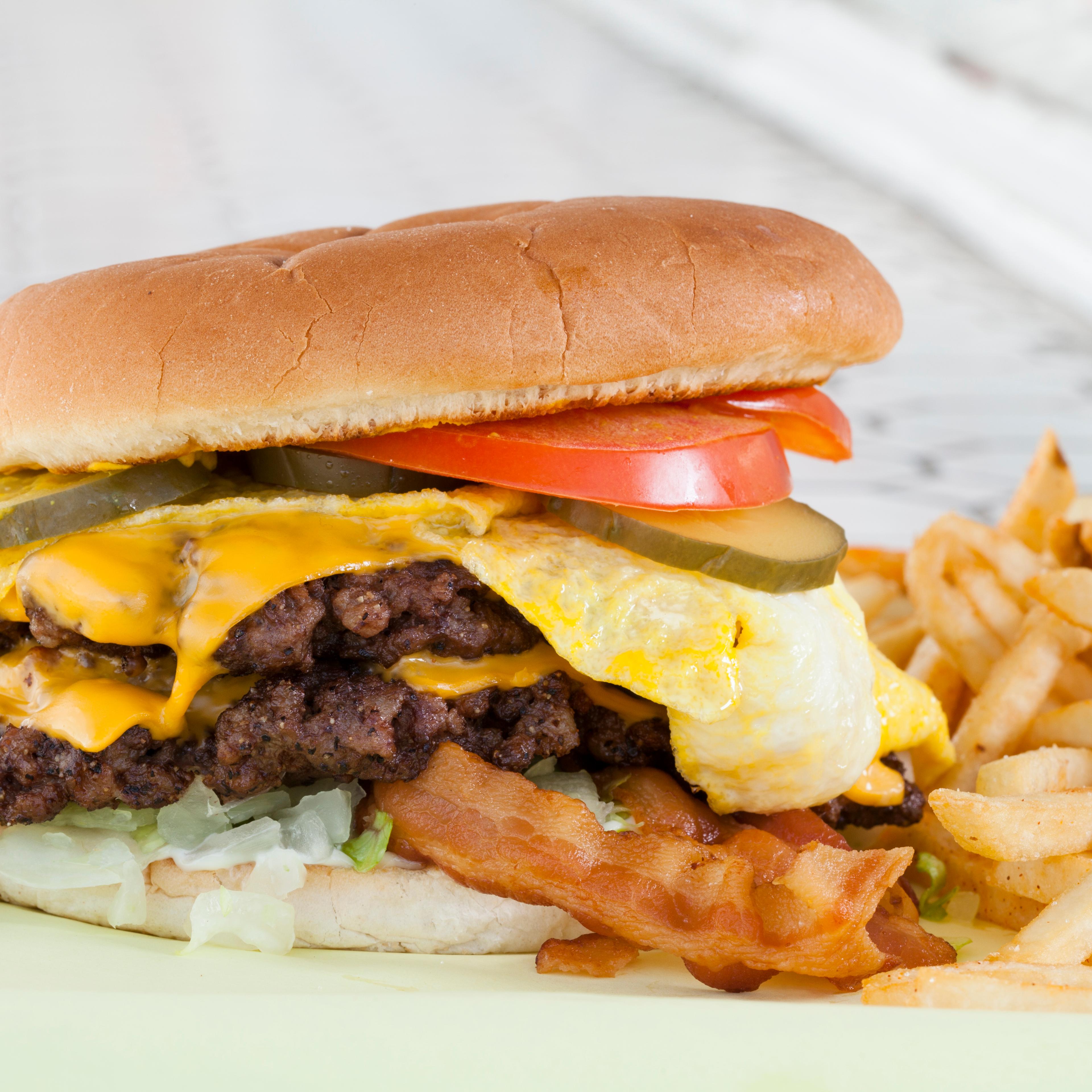 Double cheeseburger with egg, bacon & french fries