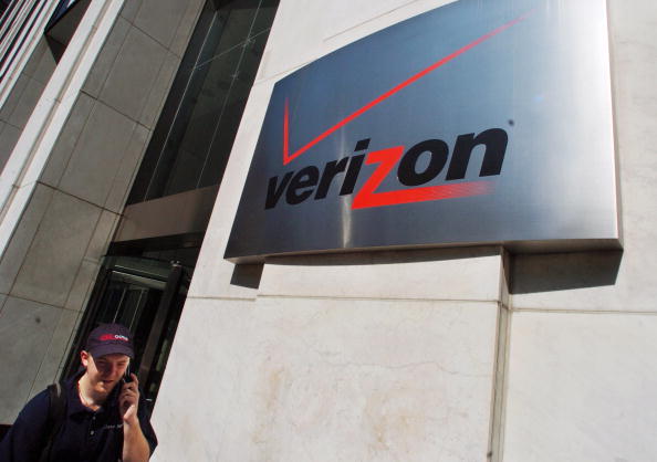 A pedestrian walks past the Verizon Communications Inc. headquarters in New York City on July 26, 2005.