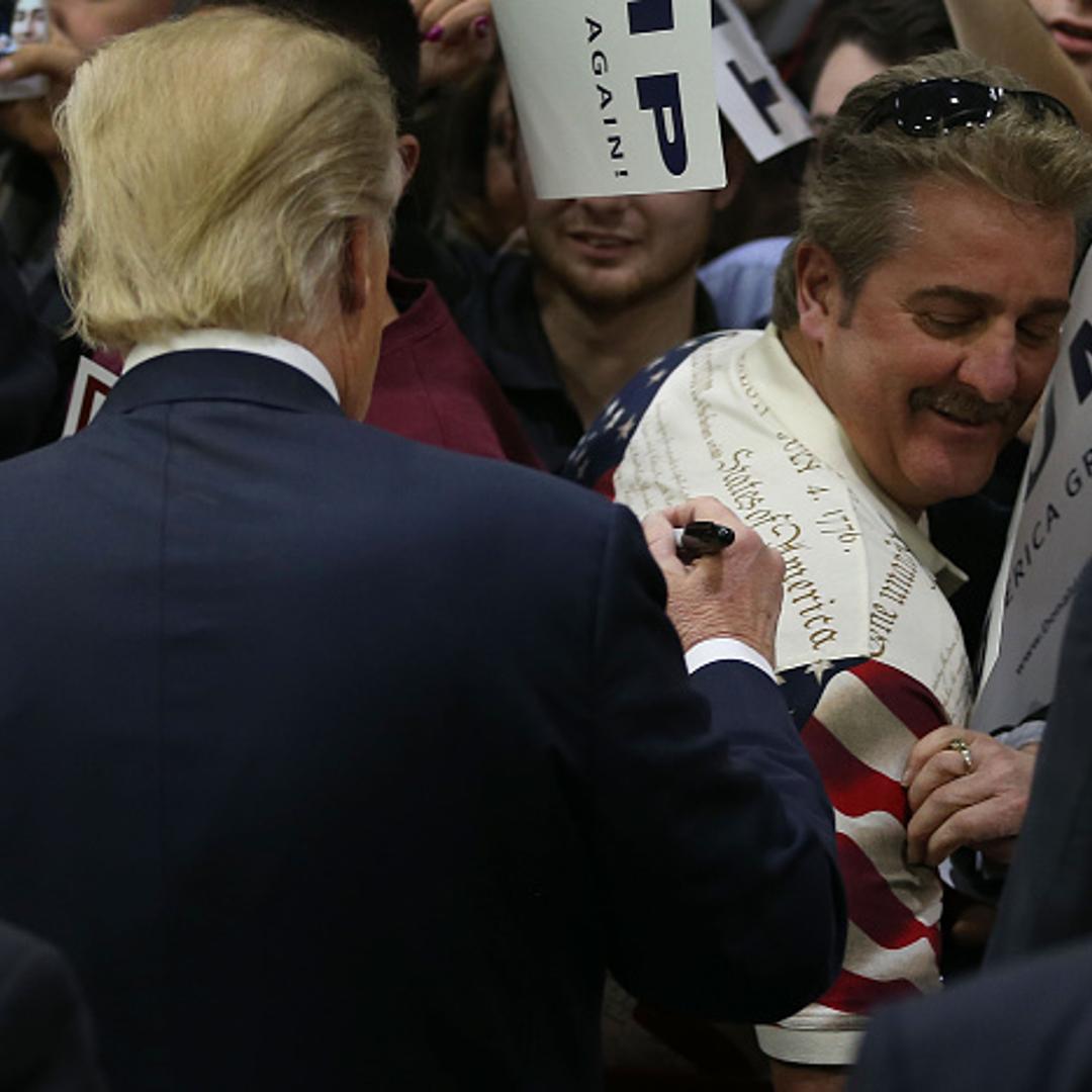 People wait for the doors to open for a Republican presidential candidate Donald Trump campaign rally at Plymouth State University on February 7, 2016 in Holdernes, New Hampshire.