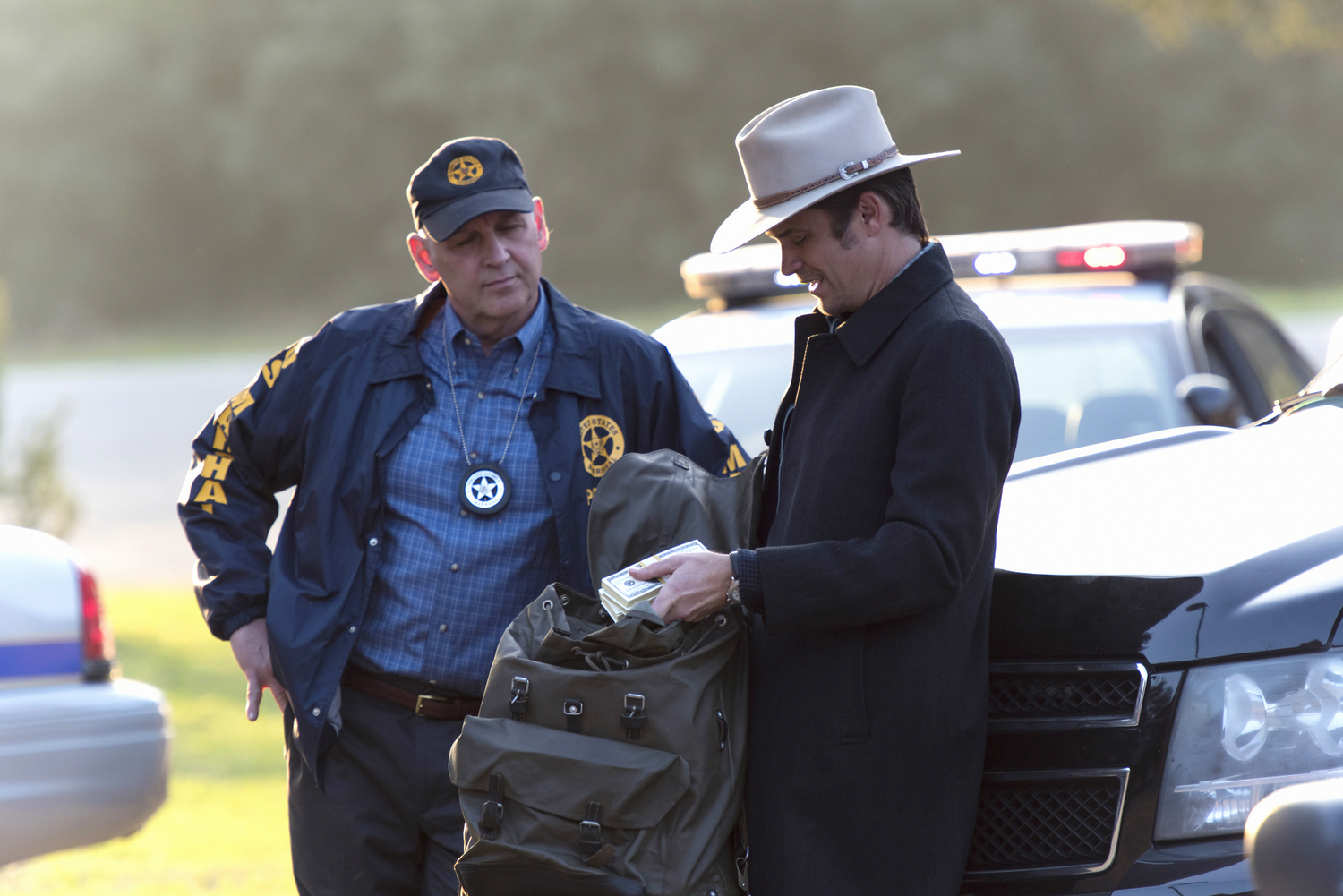 JUSTIFIED -- "Promise" Episode 313 (Airs Tuesday, April 14, 10:00 pm e/p) Pictured (l-r): Nick Searcy as Chief Deputy U.S. Marshal Art Mullen &amp; Timothy Olyphant as Deputy U.S. Marshal Raylan Givens.CR: Prashant Gupta/FX