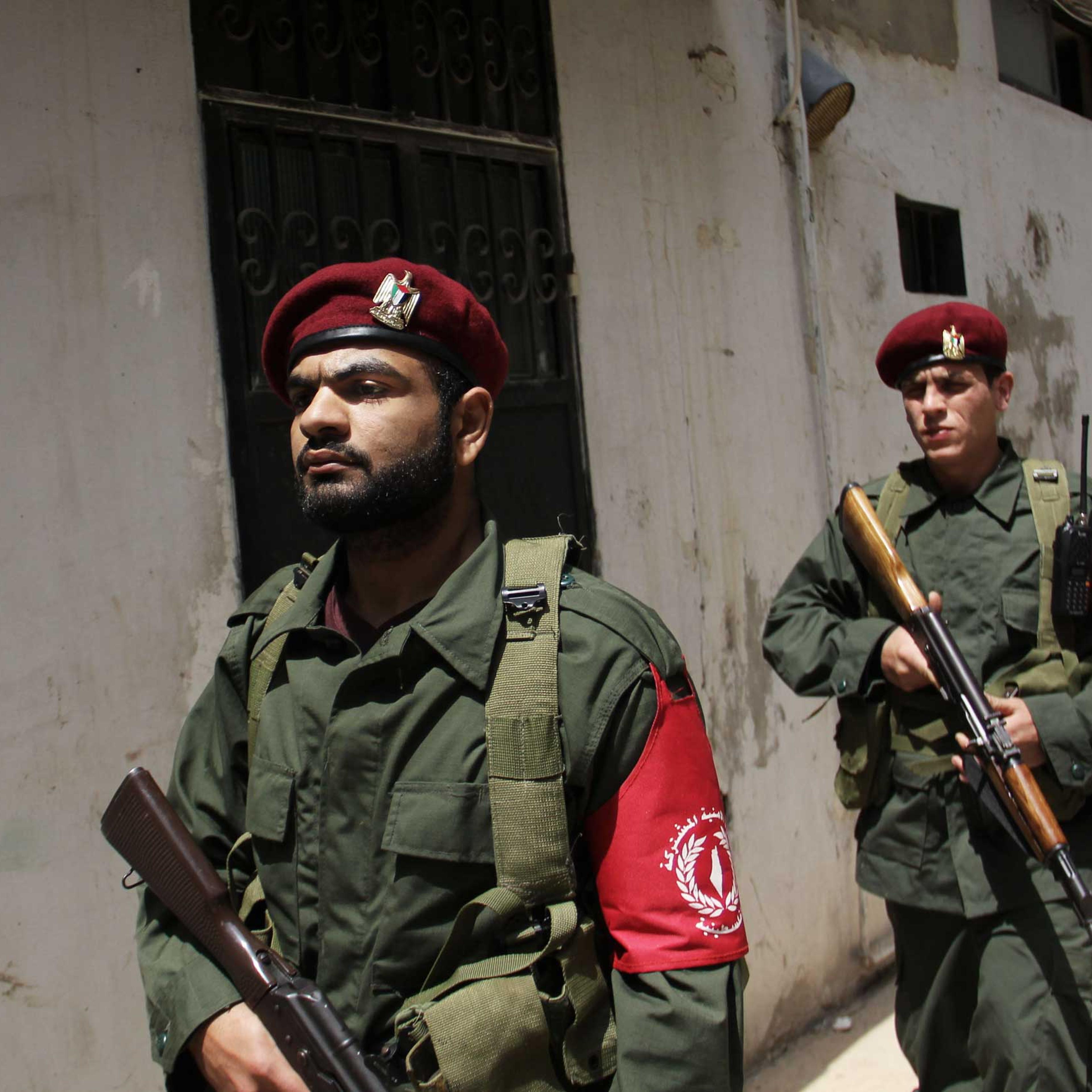 Members of a new Palestinian joint force patrol in Palestinian refugee camp Ain el-Helweh, in Lebanon on April 19, 2015.