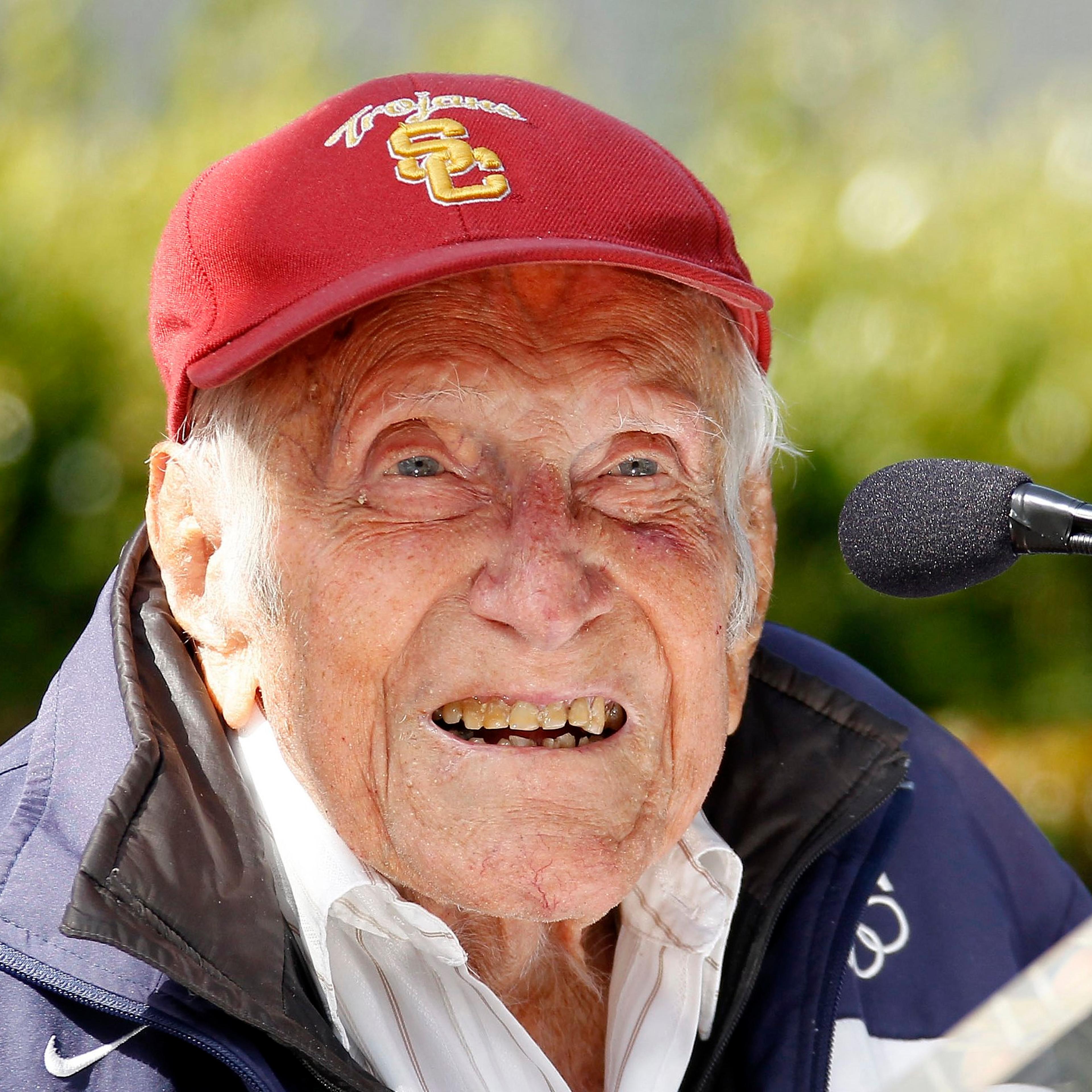 Louis Zamperini gestures during a news conference, in Pasadena, Calif. Zamperini, a U.S. Olympic distance runner and World War II veteran who survived 47 days on a raft in the Pacific after his bomber crashed, then endured two years in Japanese prison ca