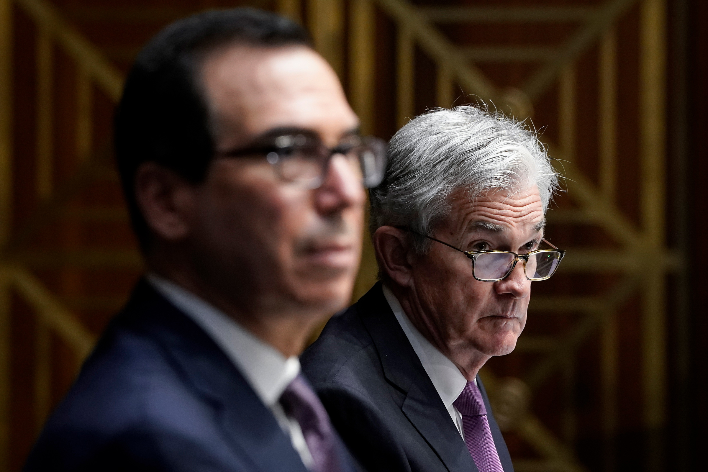 Treasury Secretary Steven Mnuchin and Federal Reserve Board Chairman Jerome Powell testify during a Senate Banking Committee hearing on Capitol Hill on Sept. 24