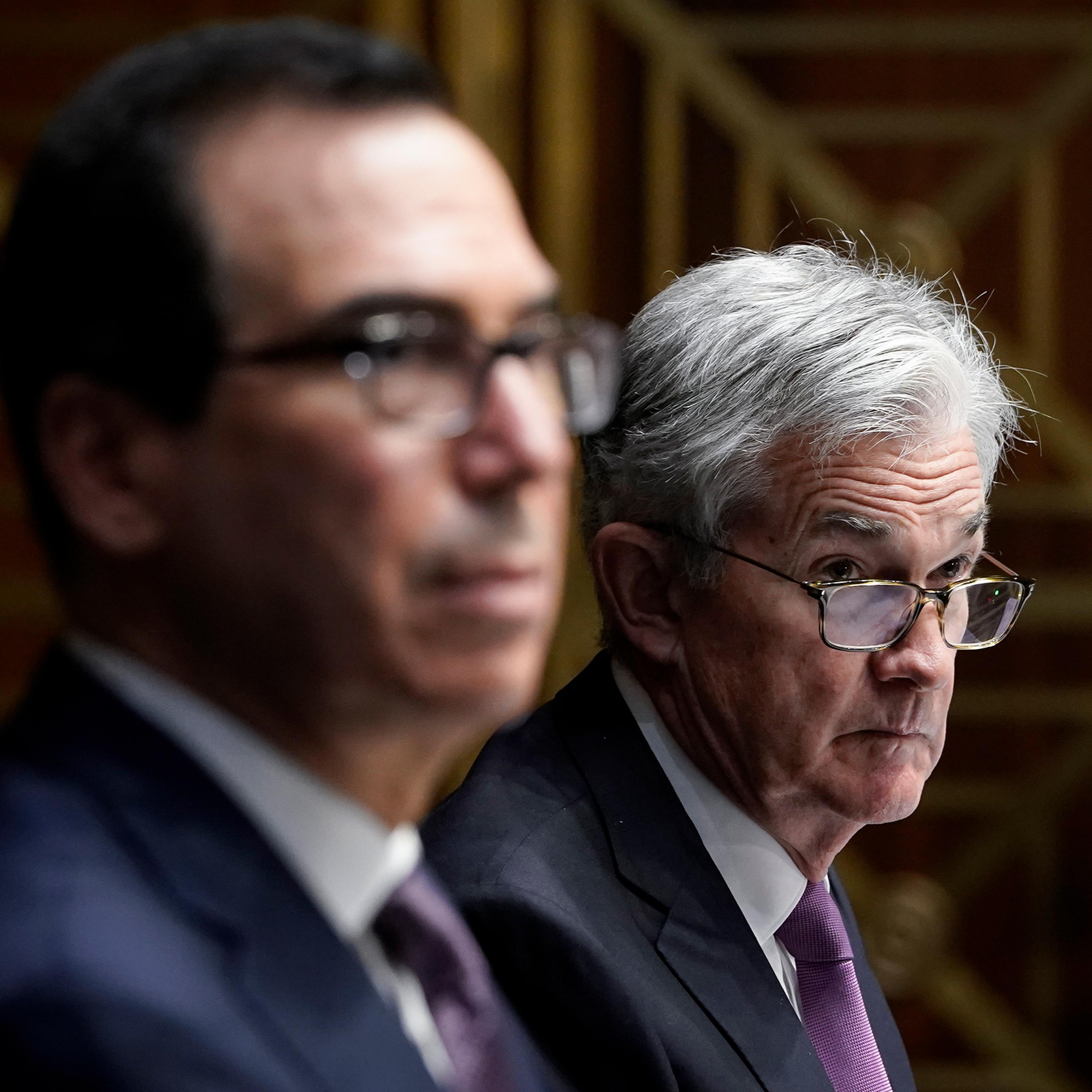 Treasury Secretary Steven Mnuchin and Federal Reserve Board Chairman Jerome Powell testify during a Senate Banking Committee hearing on Capitol Hill on Sept. 24