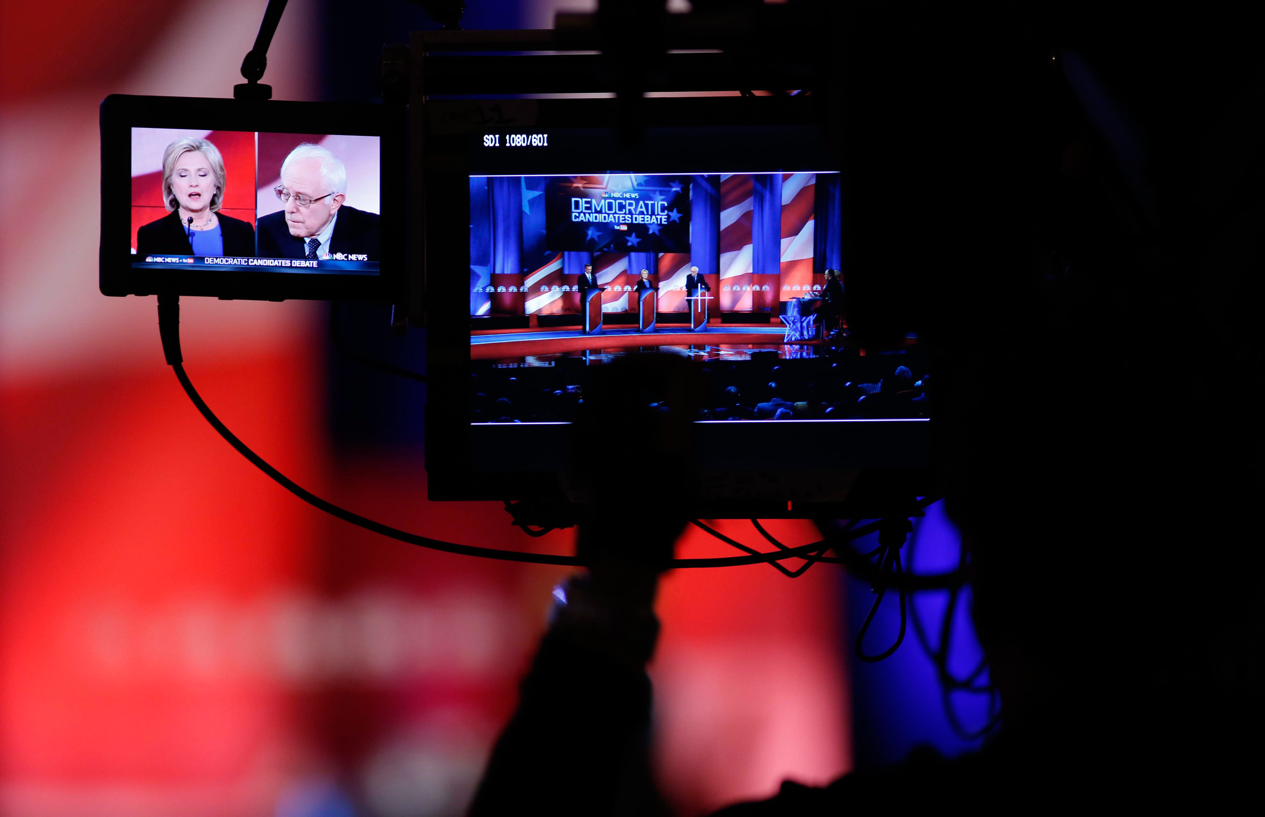 A camera man focuses on Democratic presidential candidates Hillary Clinton and Sen. Bernie Sanders, I-Vt, as they participate in the NBC, YouTube Democratic presidential debate at the Gaillard Center, Sunday, Jan. 17, 2016, in Charleston, S.C. (AP Photo/