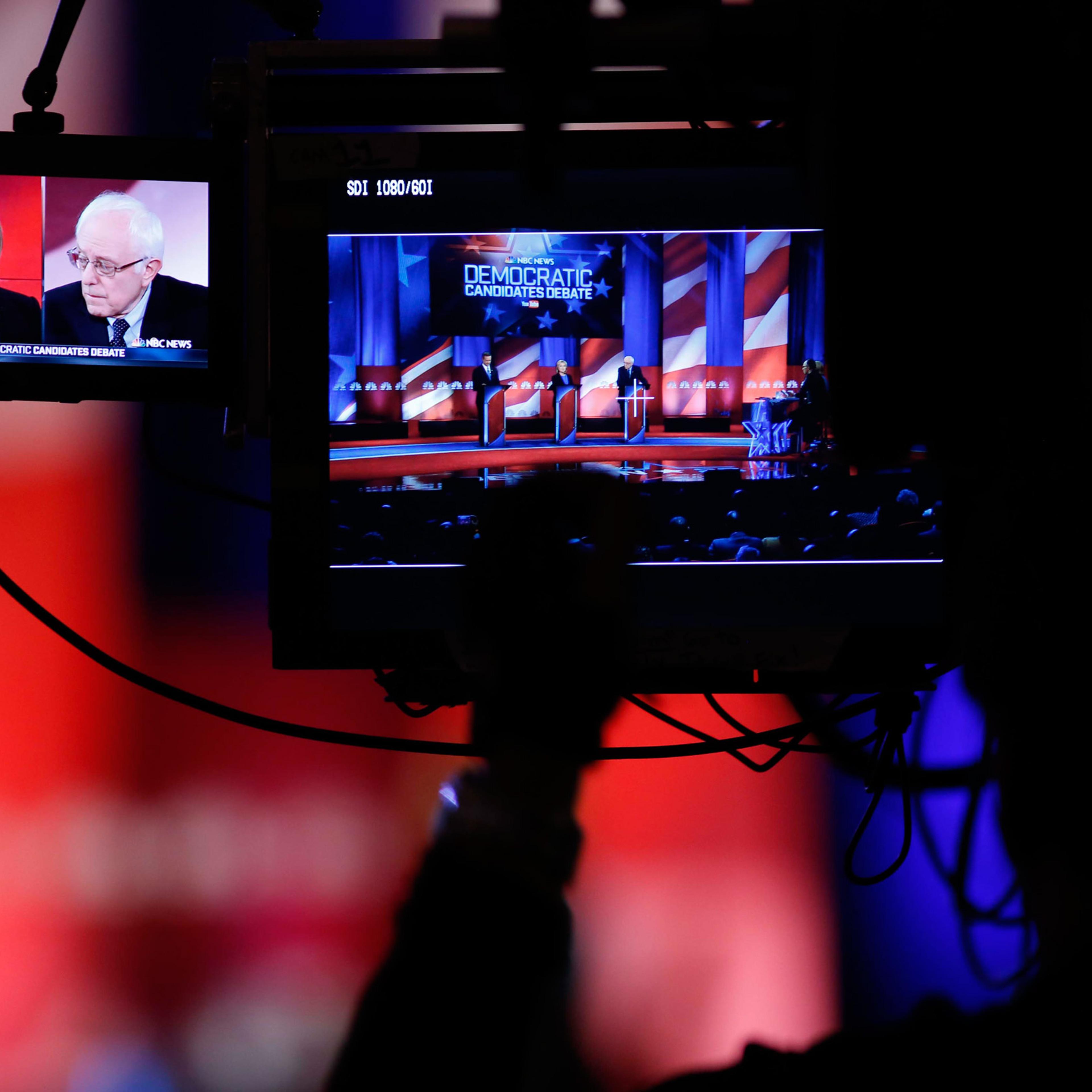 A camera man focuses on Democratic presidential candidates Hillary Clinton and Sen. Bernie Sanders, I-Vt, as they participate in the NBC, YouTube Democratic presidential debate at the Gaillard Center, Sunday, Jan. 17, 2016, in Charleston, S.C. (AP Photo/