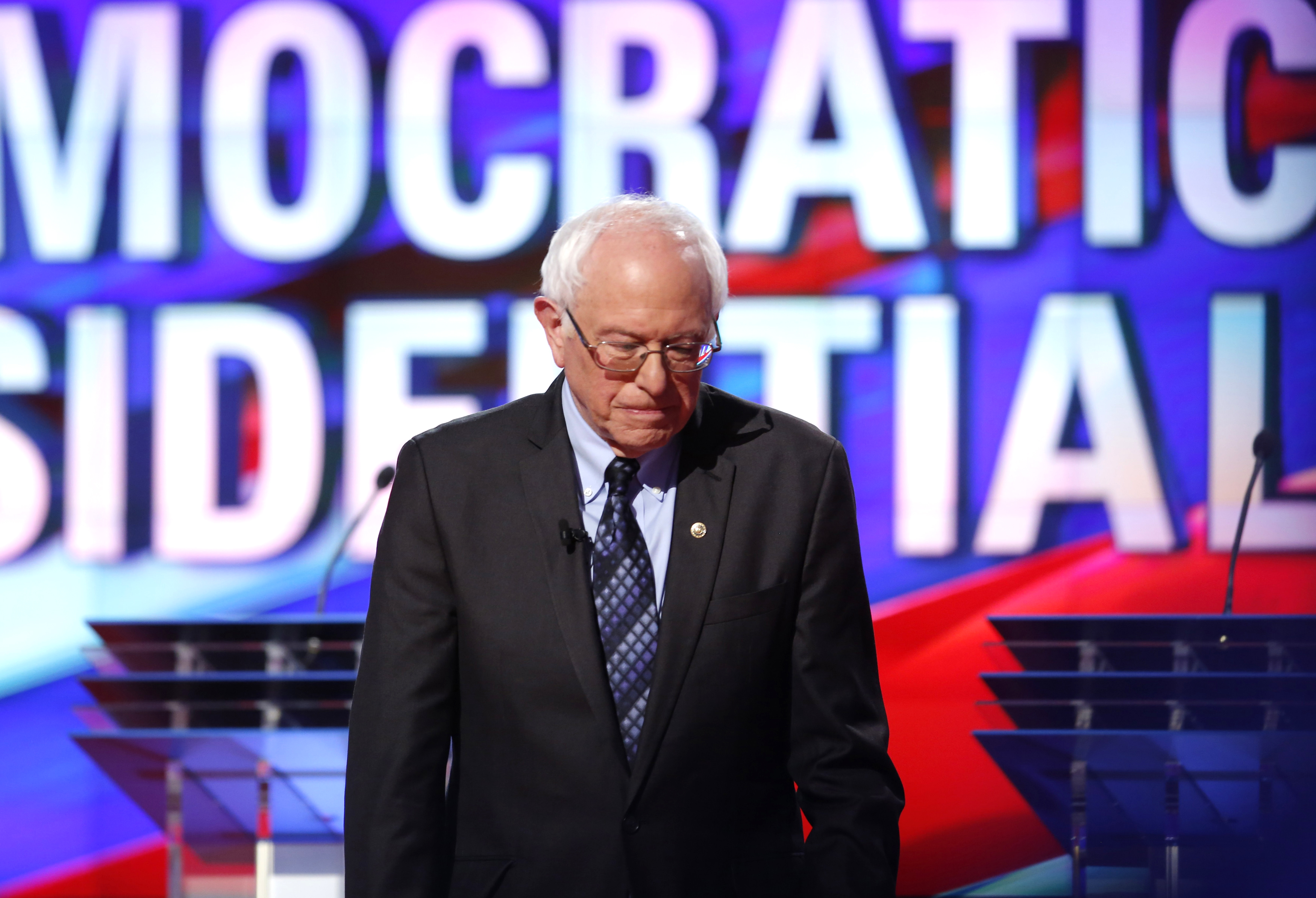 Democratic U.S. presidential candidate Bernie Sanders heads to his podium at the start the Democratic U.S. presidential candidates' debate in Flint, Mich. on March 6, 2016.