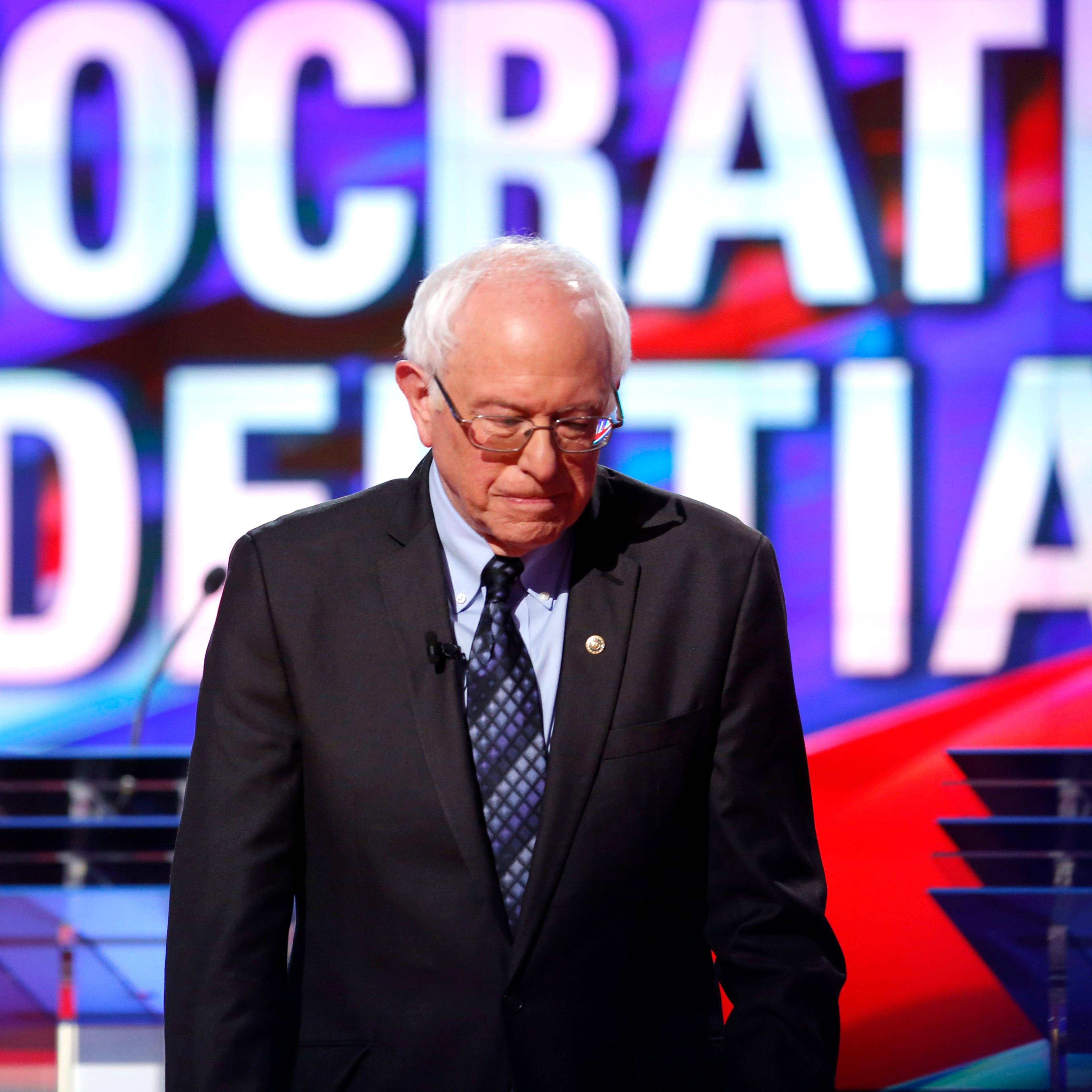 Democratic U.S. presidential candidate Bernie Sanders heads to his podium at the start the Democratic U.S. presidential candidates' debate in Flint, Mich. on March 6, 2016.
