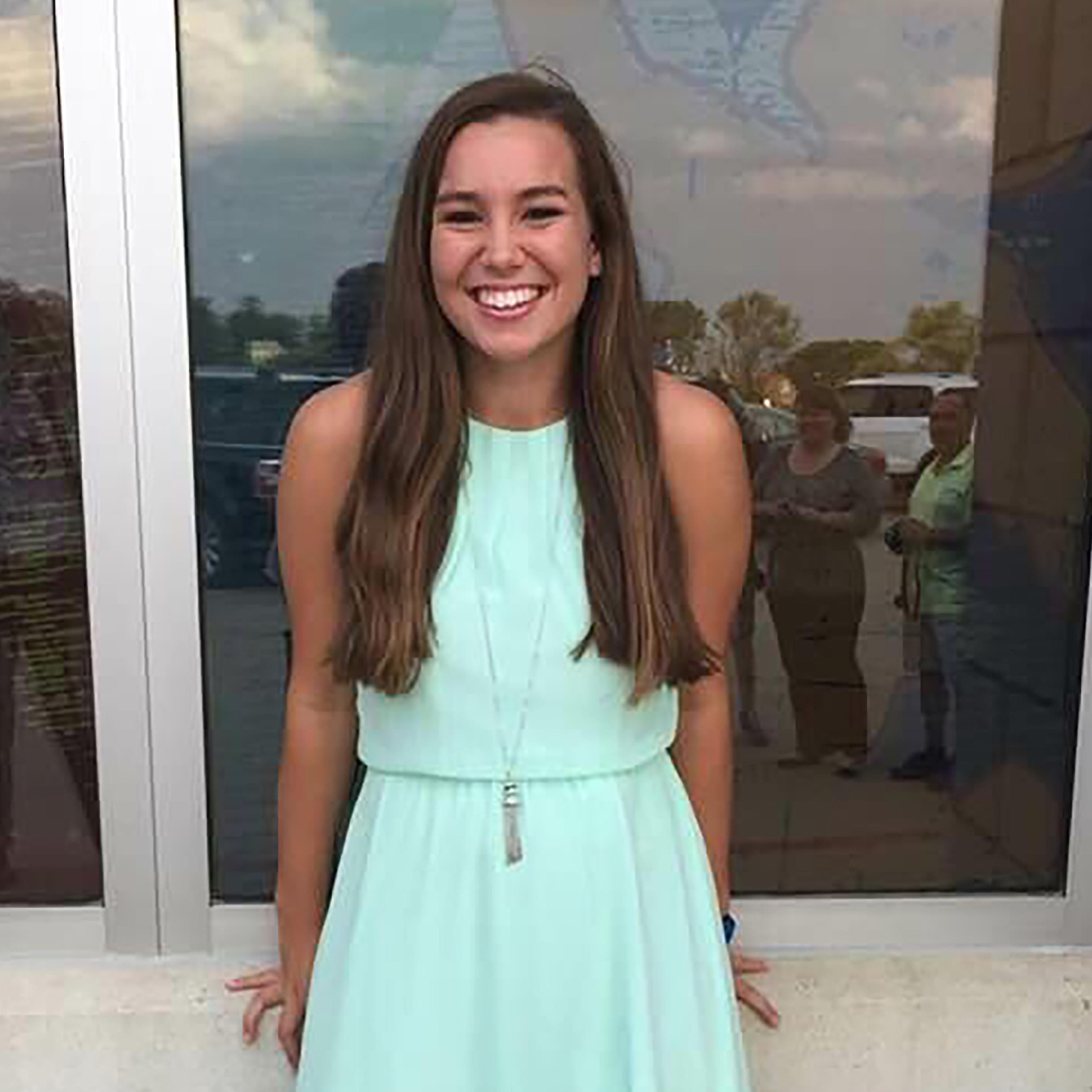 Mollie Tibbetts smiling in a blue dress