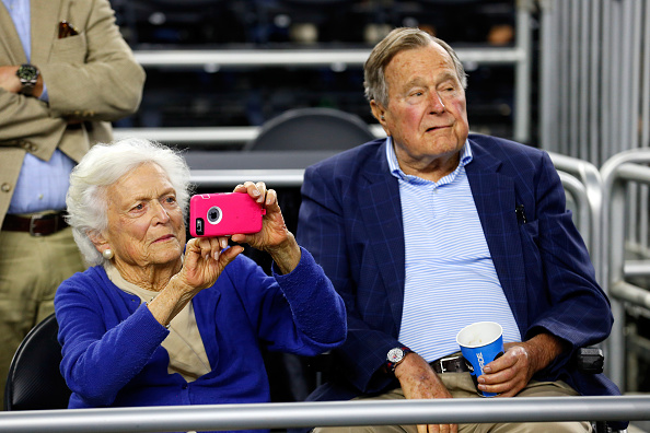 Former First Lady Barbara Bush and former President George H.W. Bush look on prior to the South Regional Final of the 2015 NCAA Men's Basketball Tournament between the Duke Blue Devils and the Gonzaga Bulldogs at NRG Stadium on March 29, 2015 in Houston,