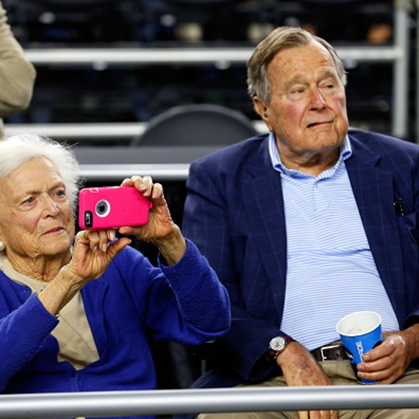 Former First Lady Barbara Bush and former President George H.W. Bush look on prior to the South Regional Final of the 2015 NCAA Men's Basketball Tournament between the Duke Blue Devils and the Gonzaga Bulldogs at NRG Stadium on March 29, 2015 in Houston,