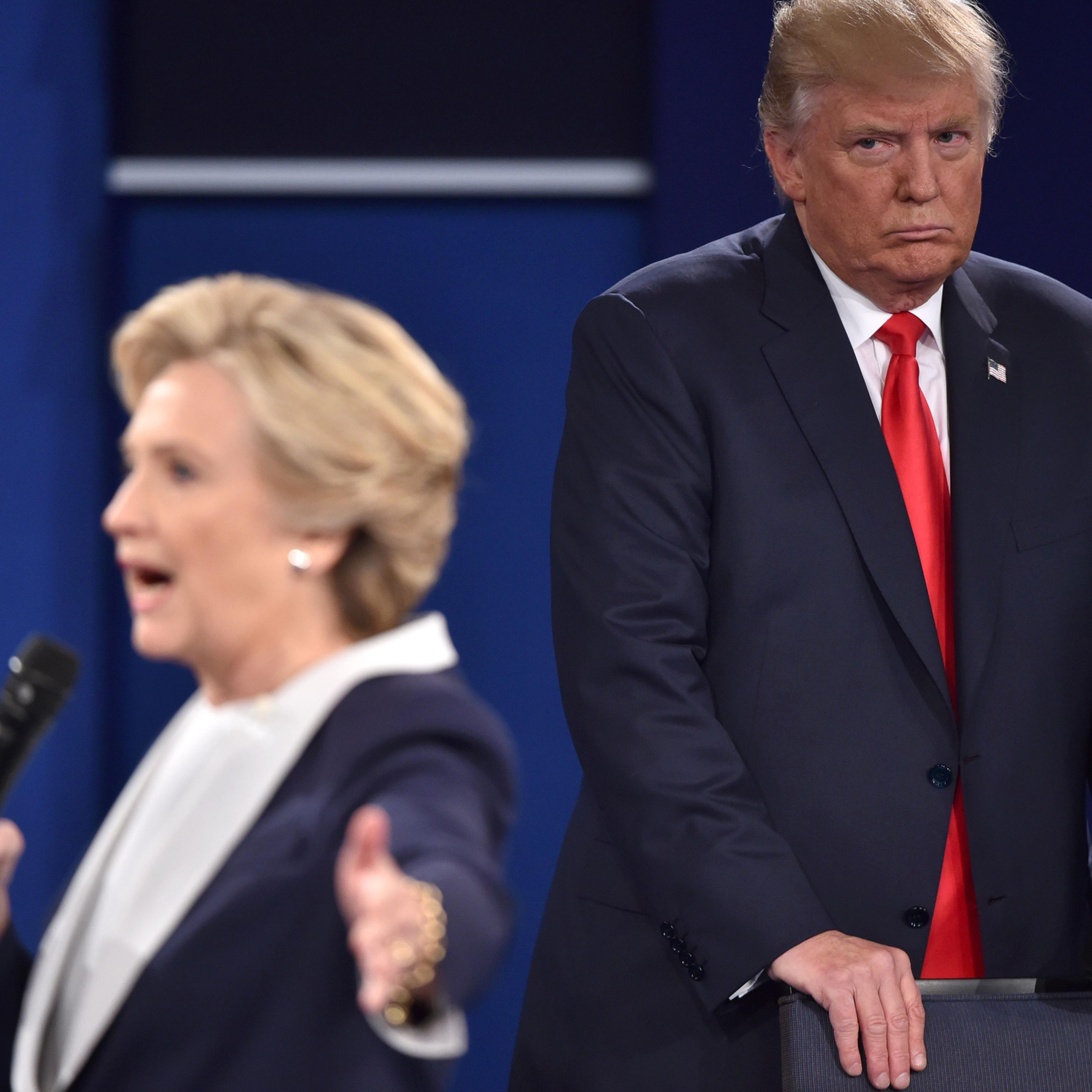 Donald Trump listens to Hillary Clinton during the second presidential debate at Washington University in St. Louis, Missouri, on Oct. 9, 2016.